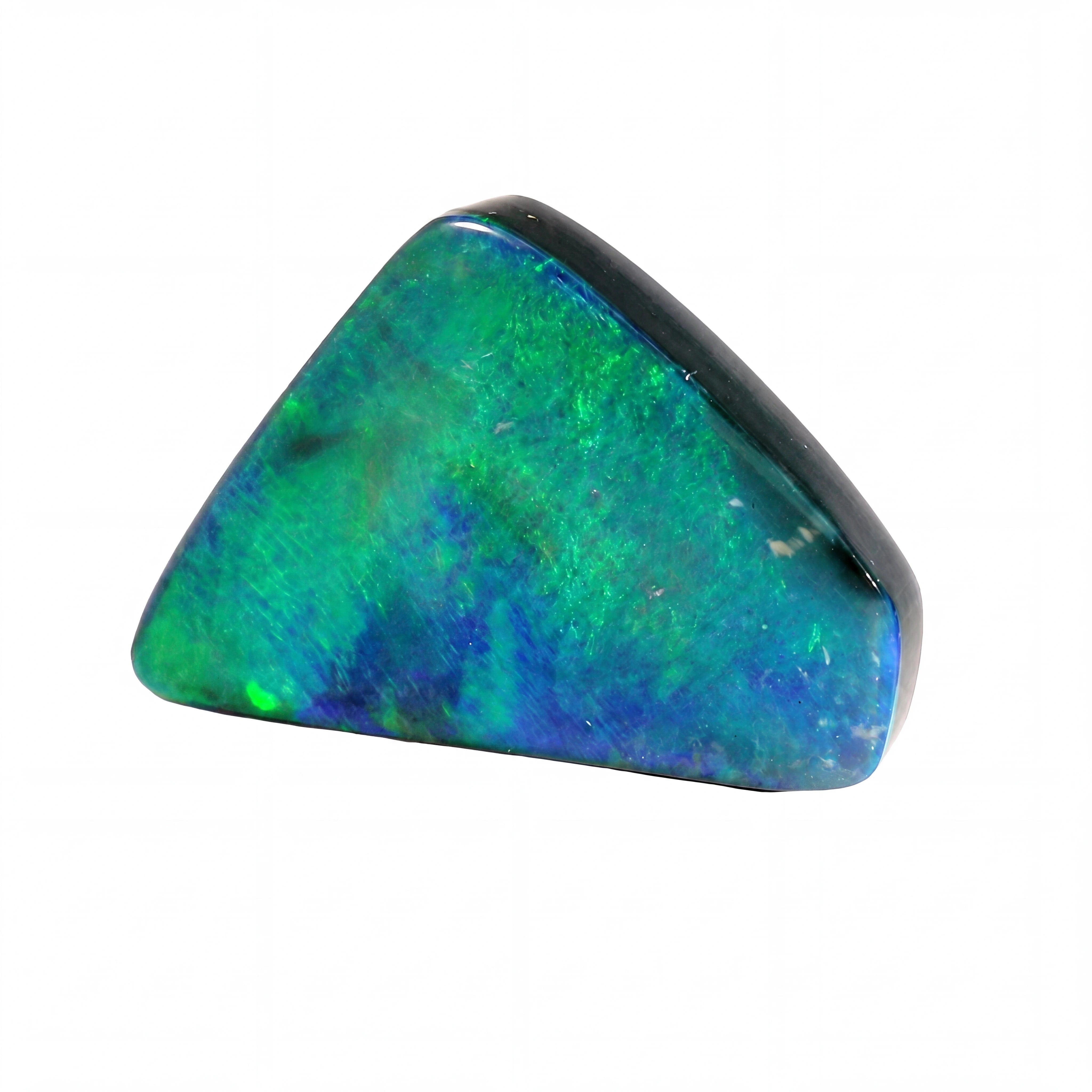 A polished triangular opal stone with vibrant green, blue, and black iridescent colours, shown on a plain white background.