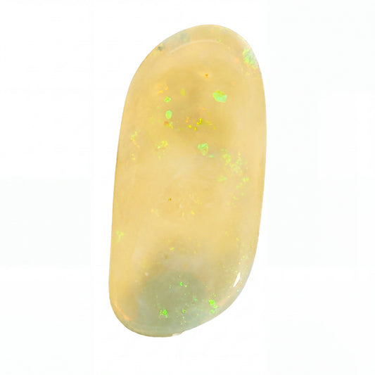 A polished oval cabochon gemstone with a creamy yellow body and scattered iridescent green flashes, shown on a plain white background.