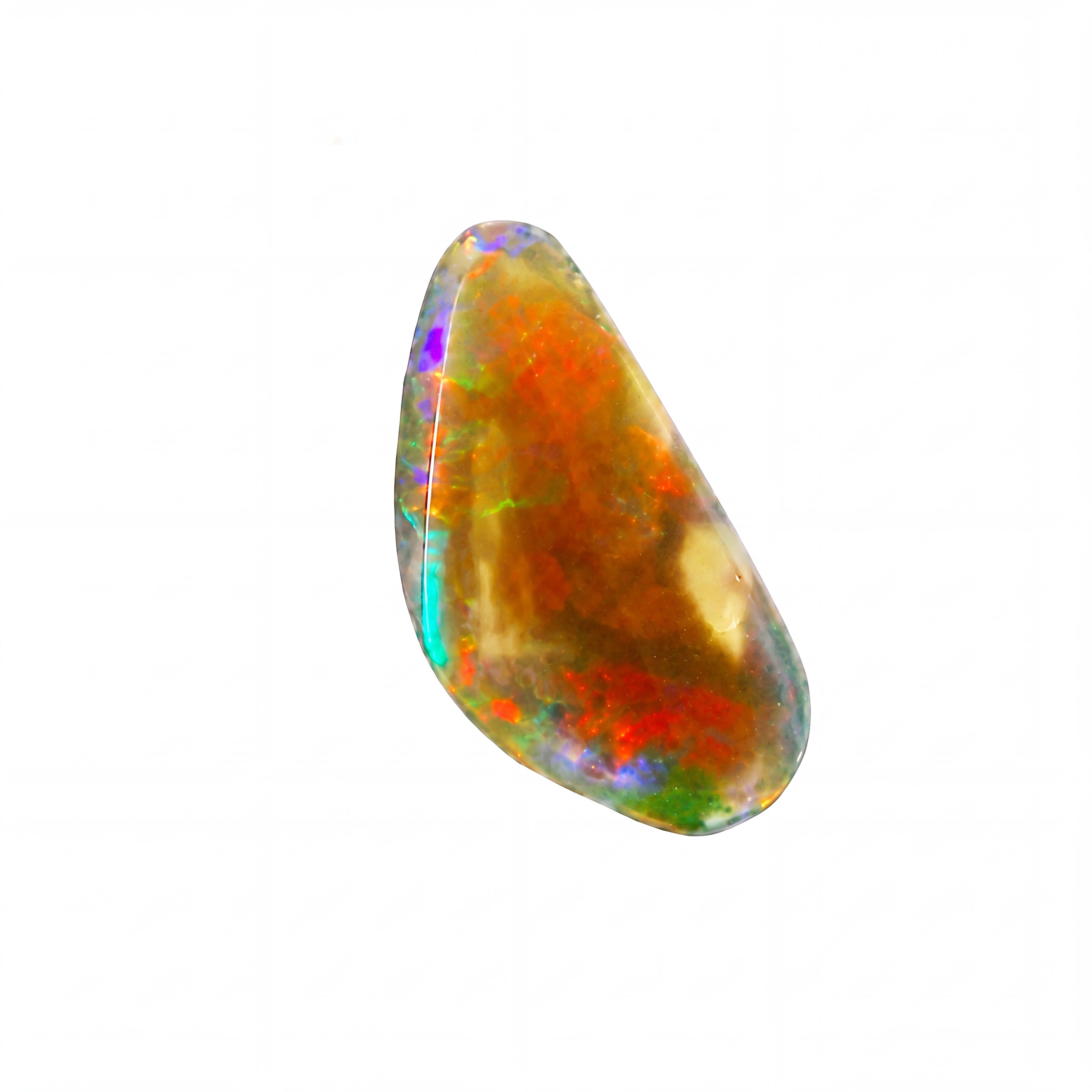 A polished teardrop-shaped opal gemstone displaying vibrant iridescent colours including orange, red, green, blue, and purple on a solid white background.