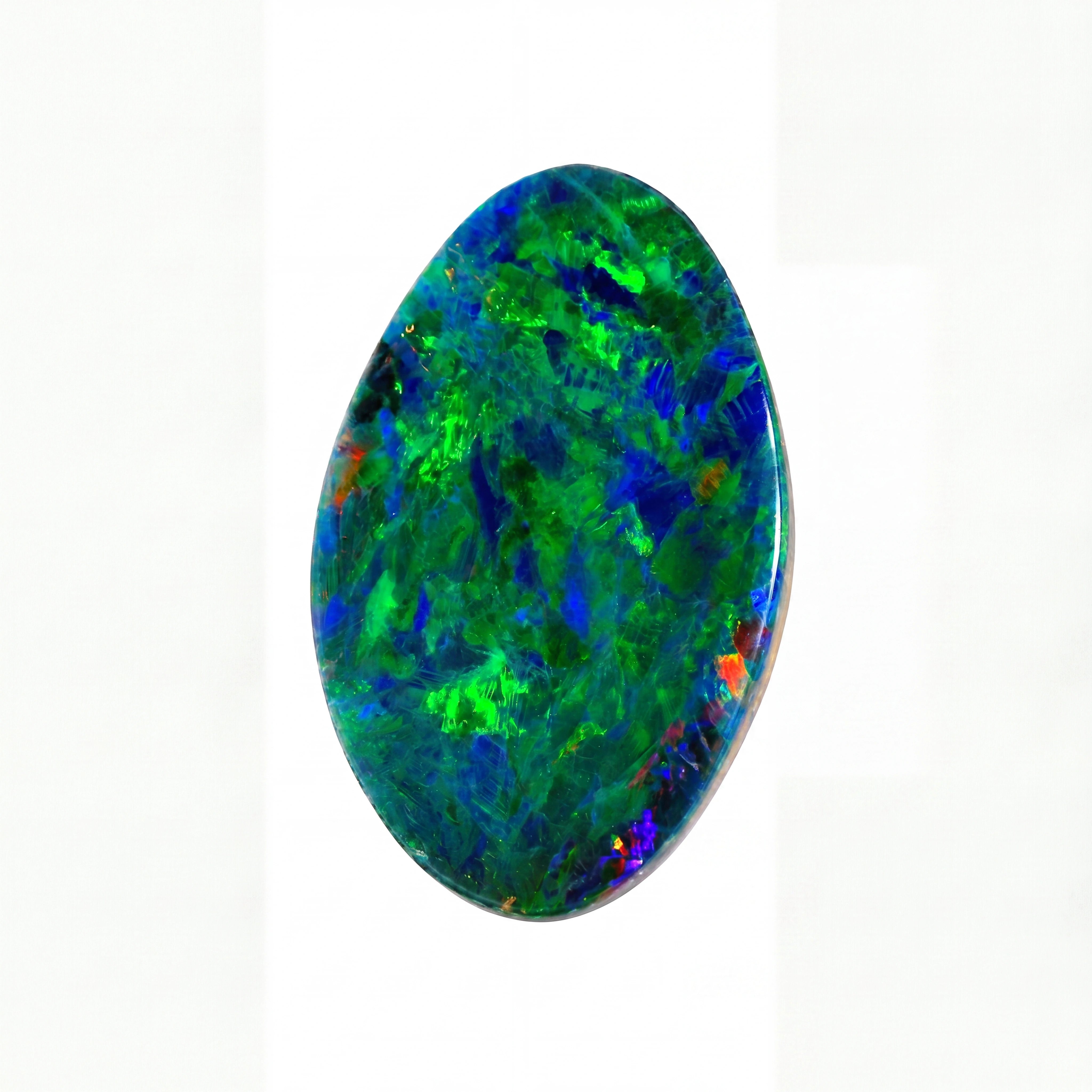 A polished oval cabochon opal gemstone displaying vibrant iridescent colours of green, blue, and orange on a plain white background.