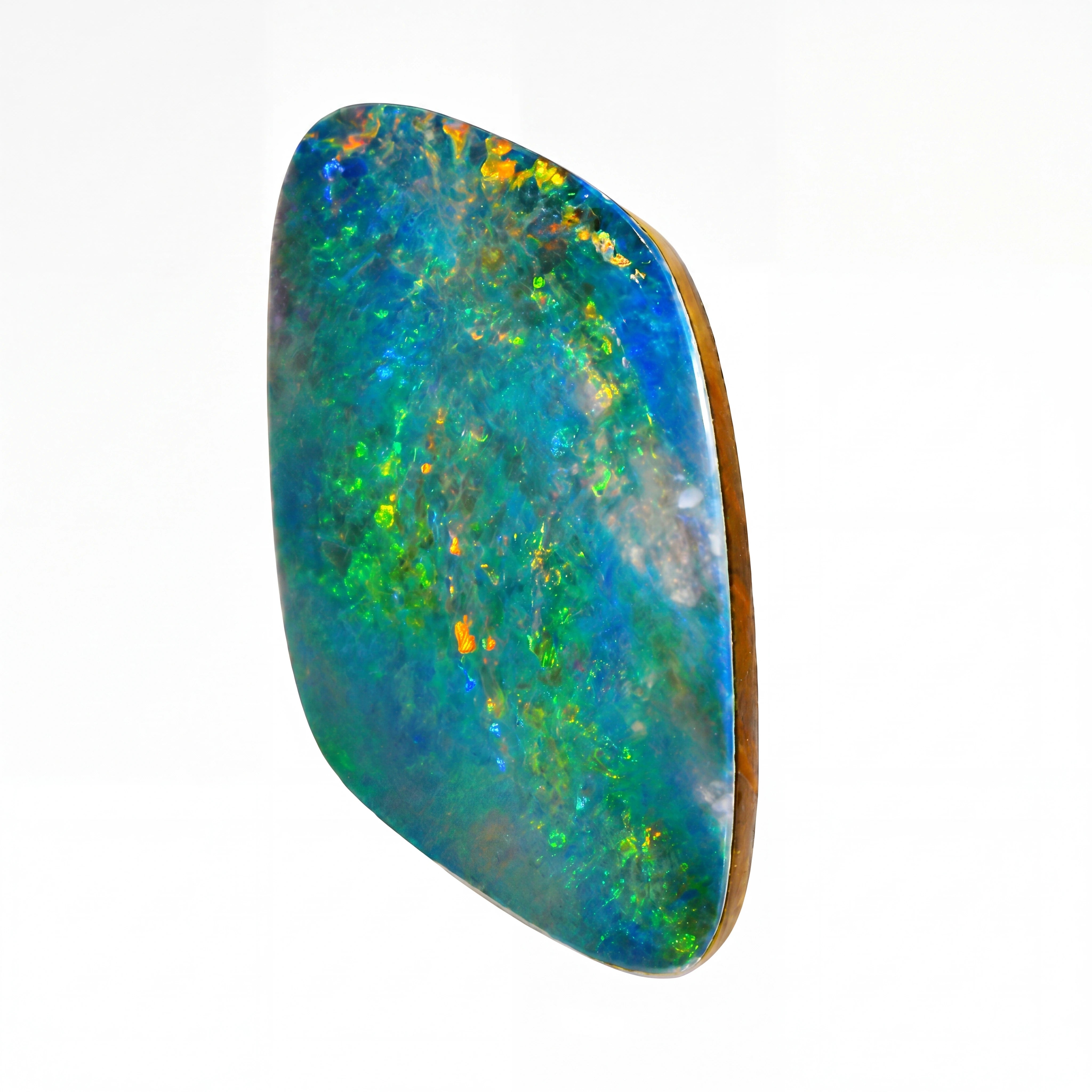 A polished cabochon opal gemstone with vibrant blue, green, and orange play-of-colour, set in a natural brown bezel, shown on a plain white background.