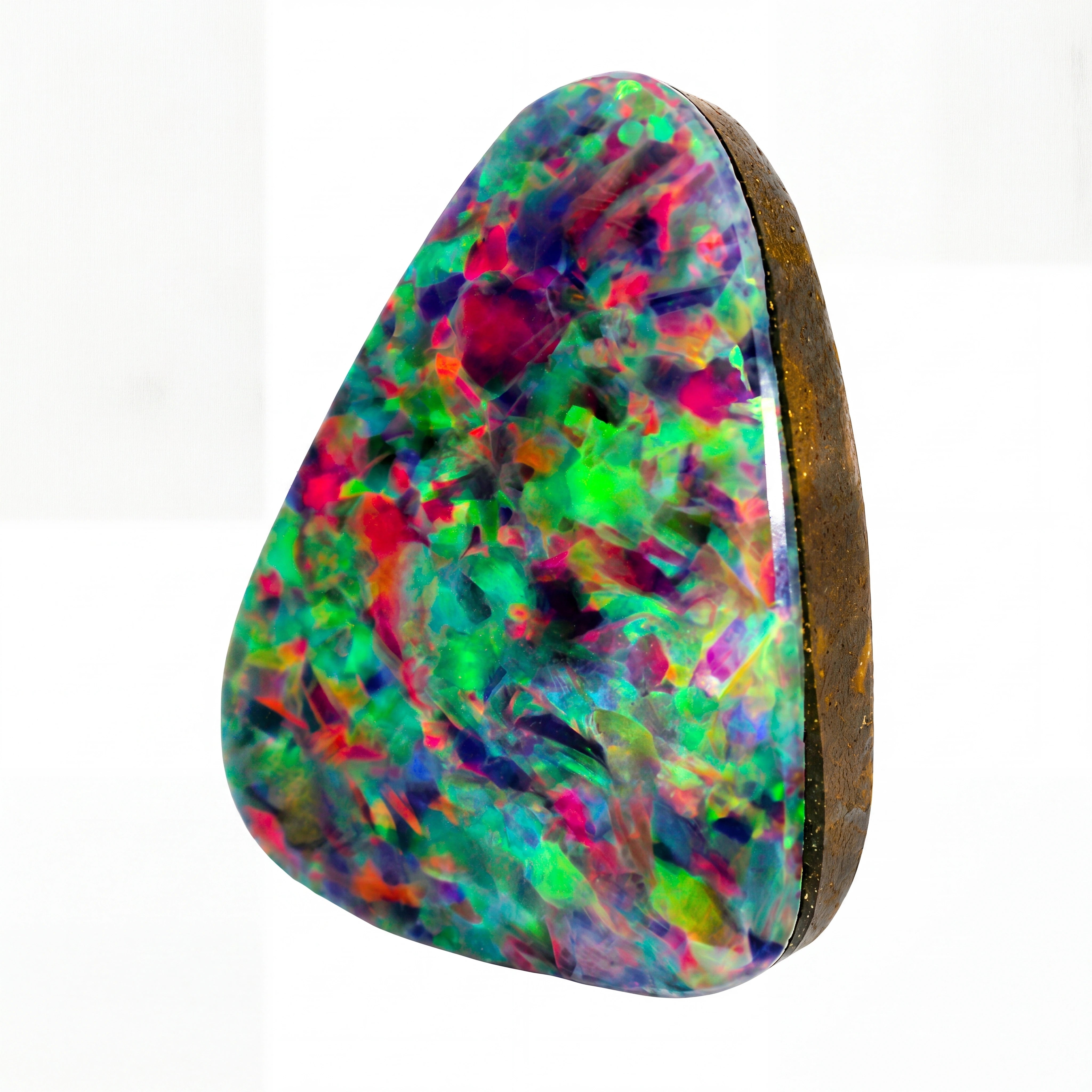 A triangular natural opal gemstone with a vibrant multicolour play-of-colour pattern featuring green, pink, purple, and blue, set in a dark brown bezel on a white background.