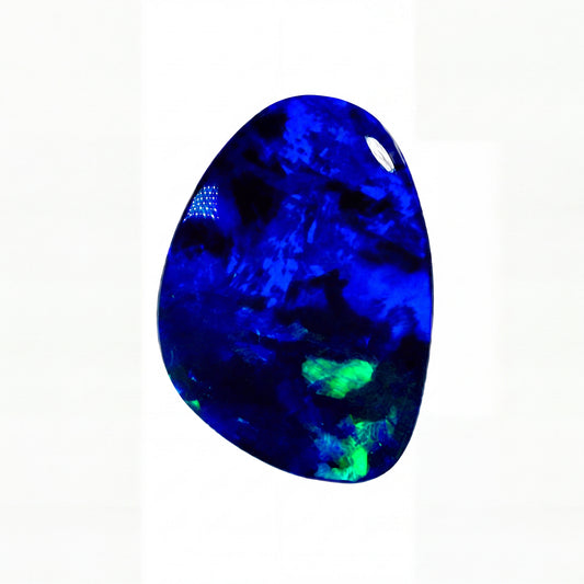 A polished, teardrop-shaped dark blue opal gemstone with vibrant blue and green flashes, centred on a plain white background.
