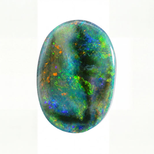 A polished oval cabochon gemstone featuring a vibrant play-of-colour pattern with green, blue, orange, and black iridescence on a white background.