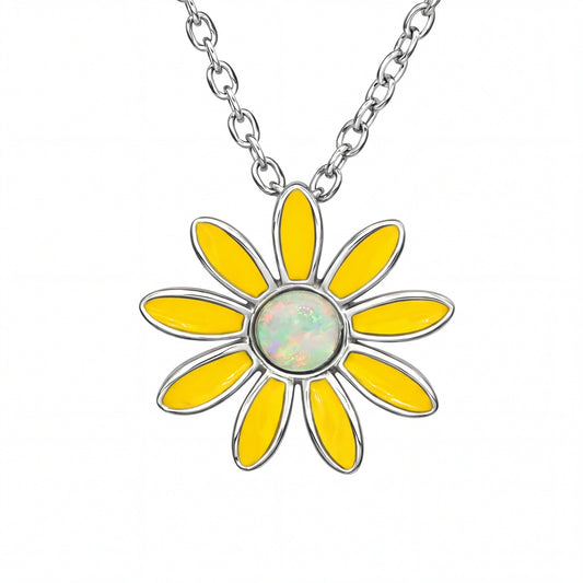 Yellow flower-shaped pendant on a silver chain against a white background
