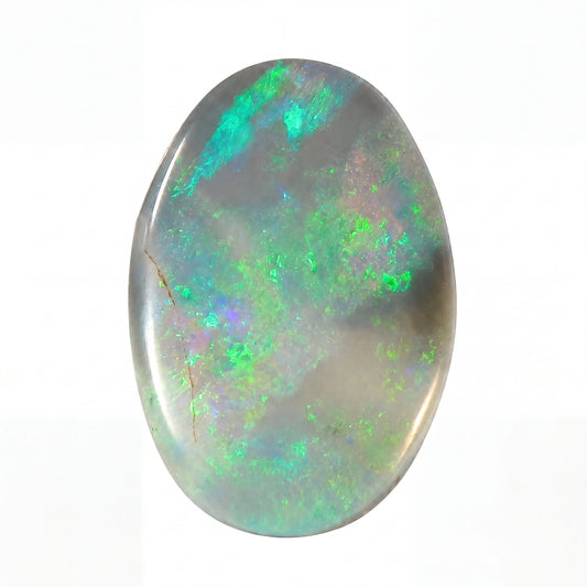 Oval-shaped opal stone with green and blue fluorescence on a white background