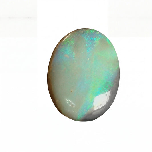 Opal stone with multicoloured play of colours on a white background