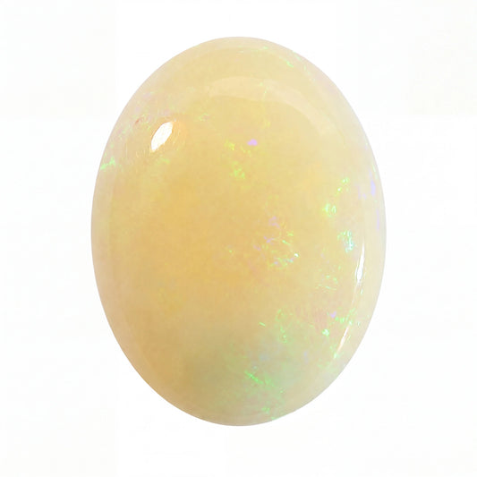A polished oval cabochon gemstone with a creamy pale yellow body and subtle iridescent flashes of green and blue, shown on a plain white background.
