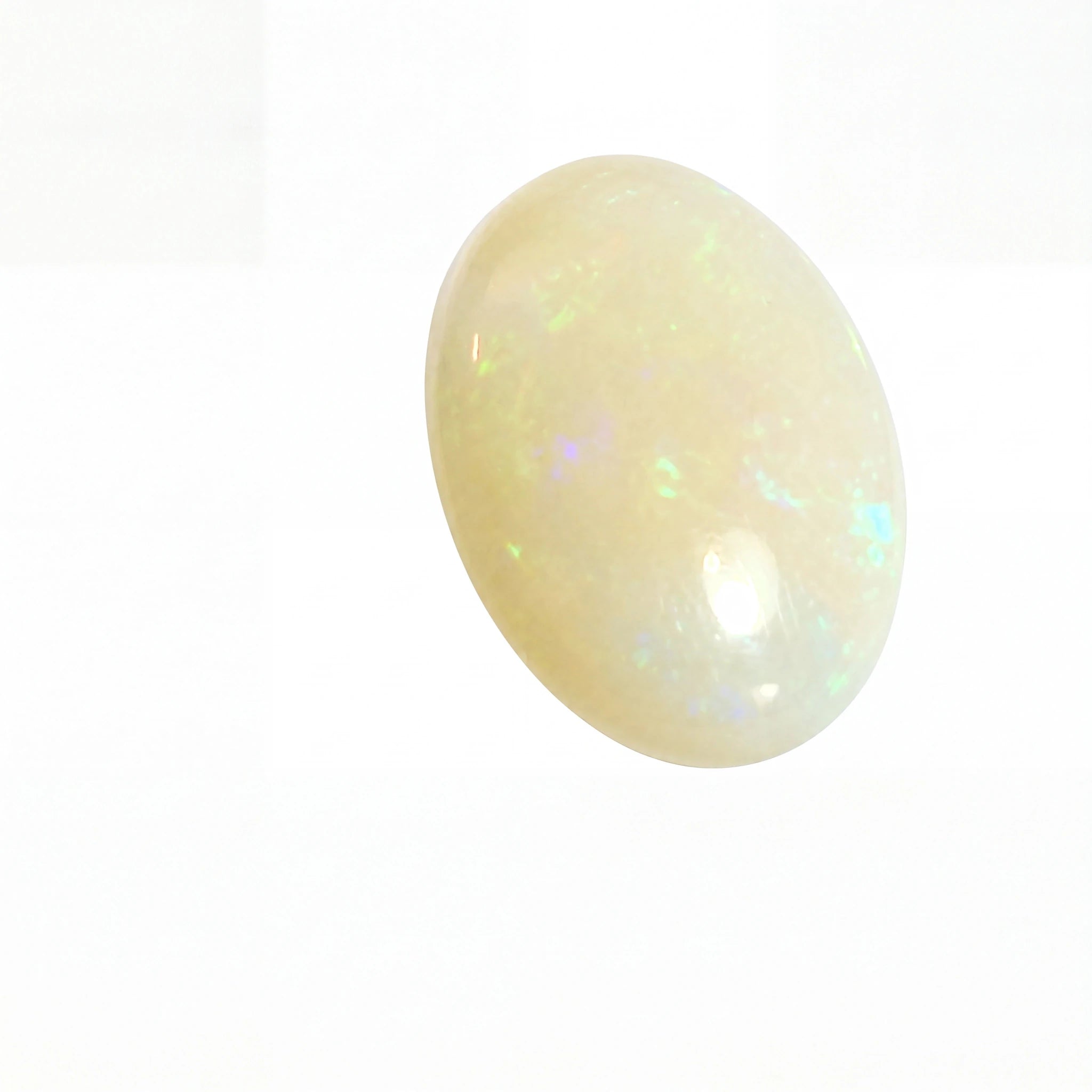 A polished oval cabochon gemstone with a milky white body and subtle iridescent flashes of blue, green, and pink, shown on a plain white background.