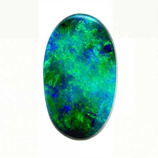 Oval-shaped opal stone with green and blue colours on a white background