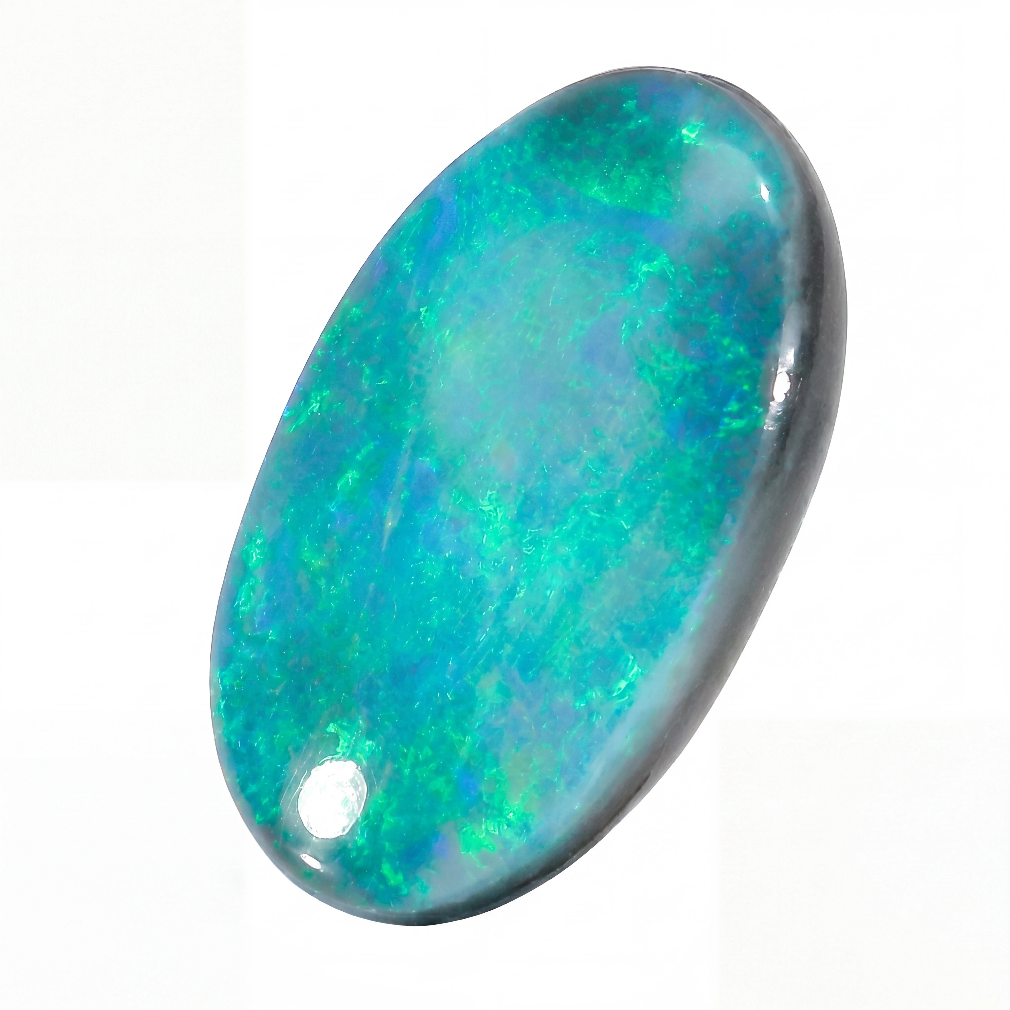 Opal stone with multicolour fluorescence on a white background