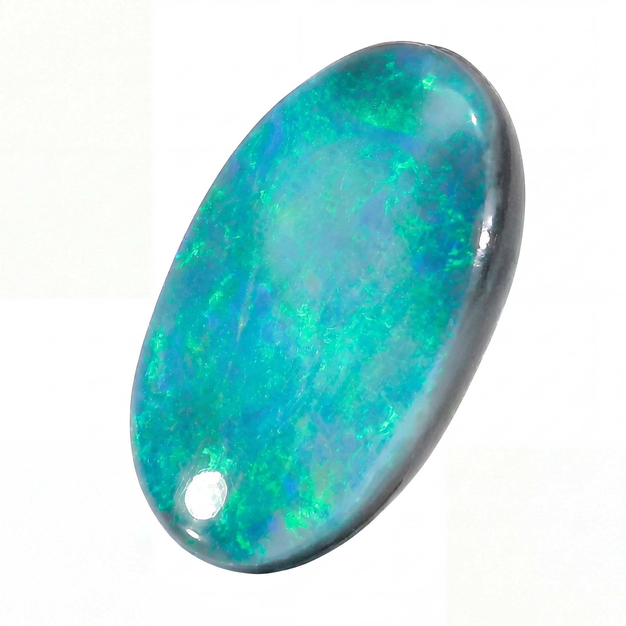 Opal stone with multicolour fluorescence on a white background