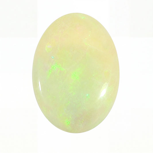 A polished oval cabochon gemstone with a milky white to pale yellow body and vibrant green iridescent flashes, shown on a plain white background.