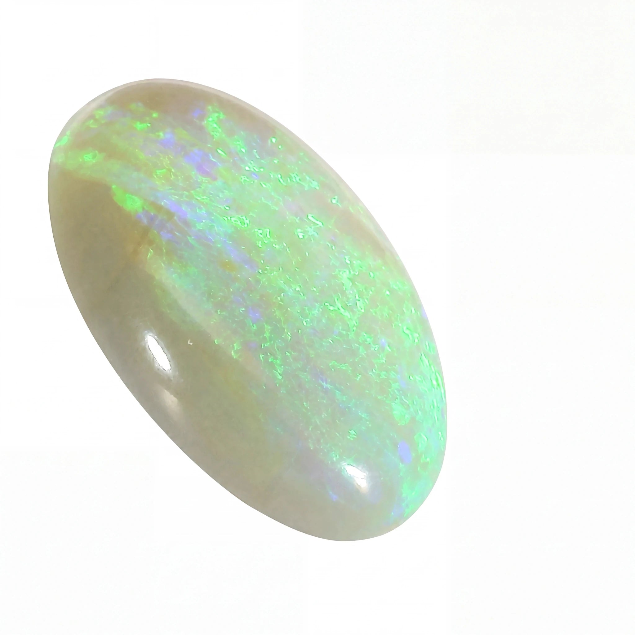 A polished oval cabochon opal gemstone showing a play-of-colour with bright green, blue, and white flashes on a pale cream base, set against a plain white background.