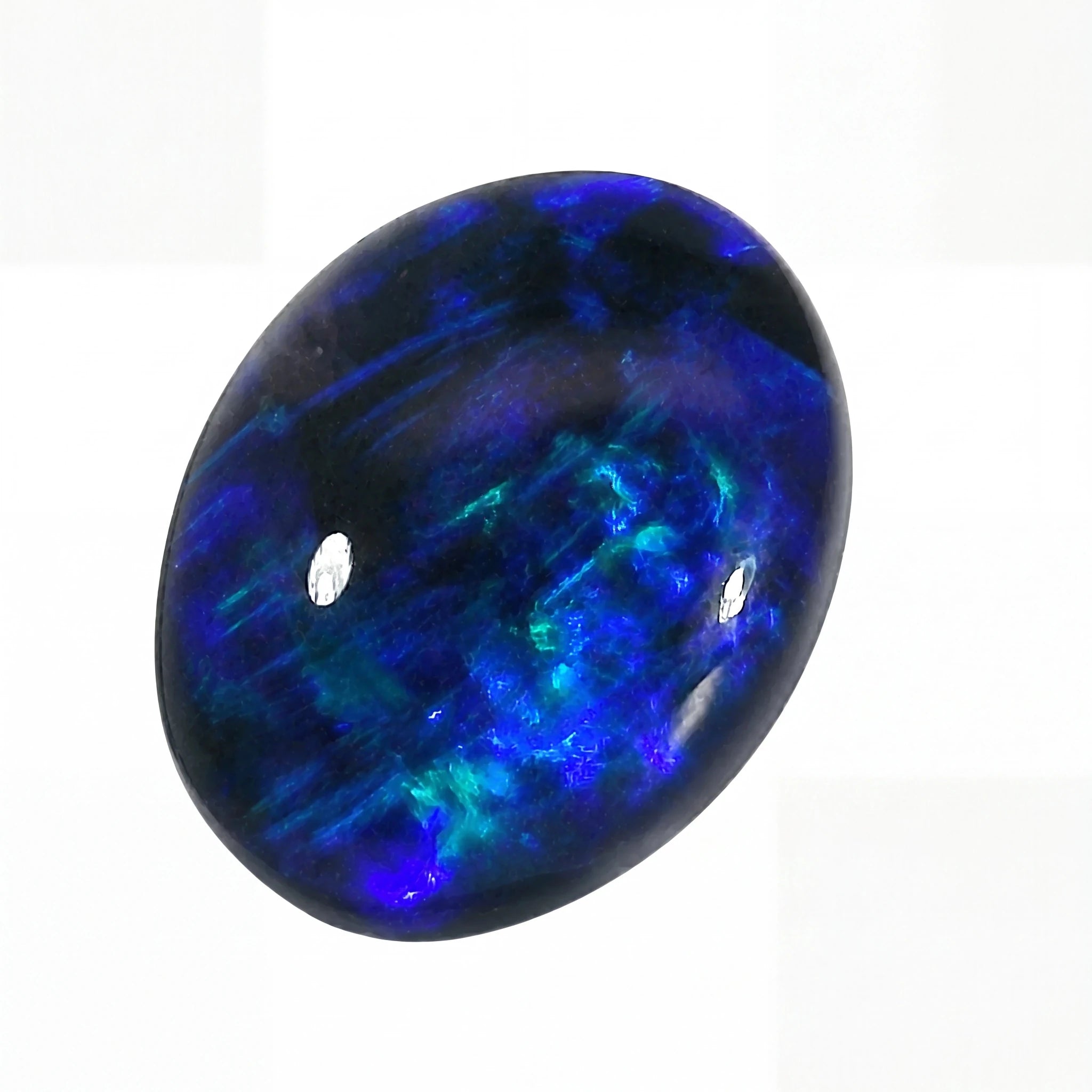 Blue and green gemstone on a white background