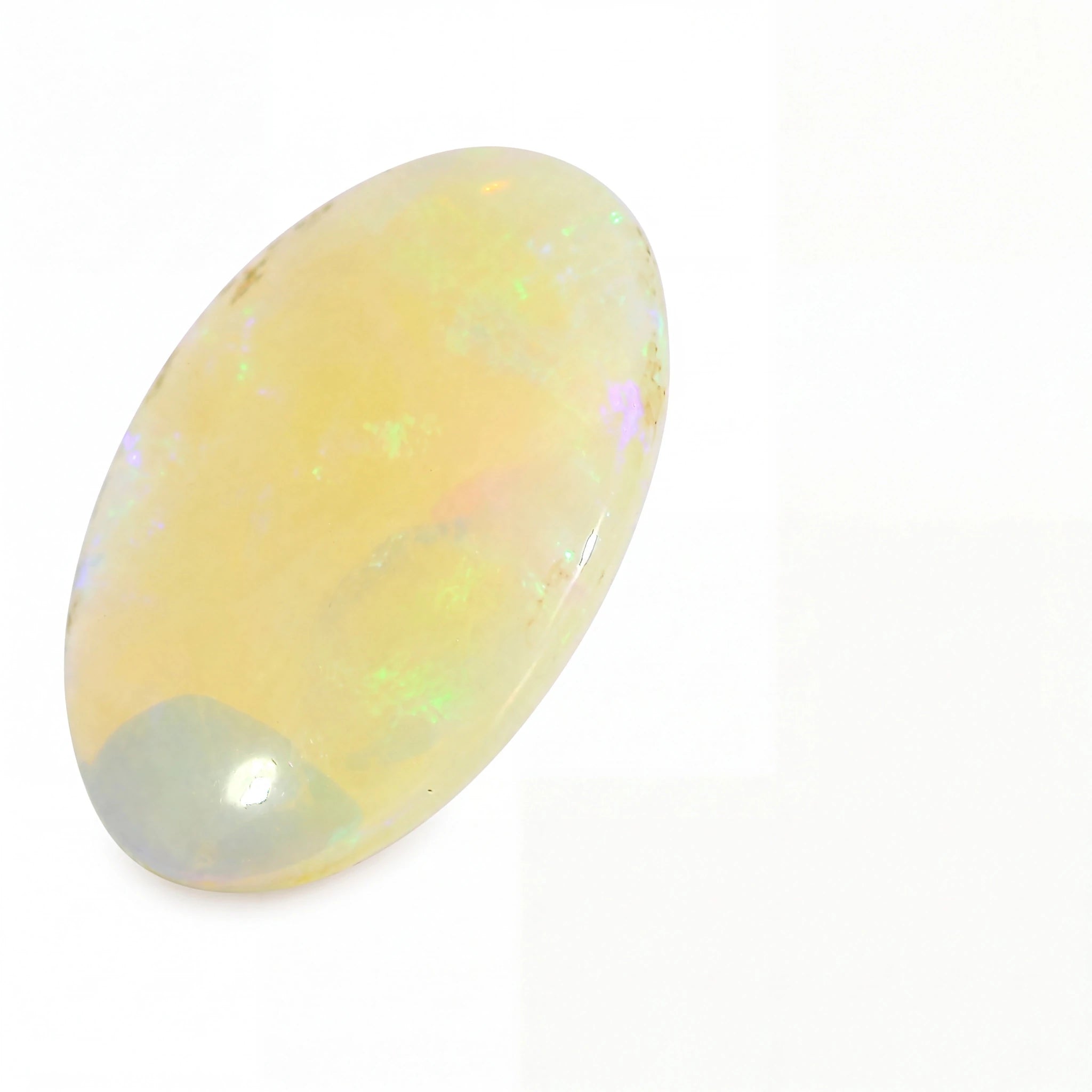 A polished oval cabochon gemstone with a pale yellow body and iridescent flashes of green, blue, and pink, set against a plain white background.
