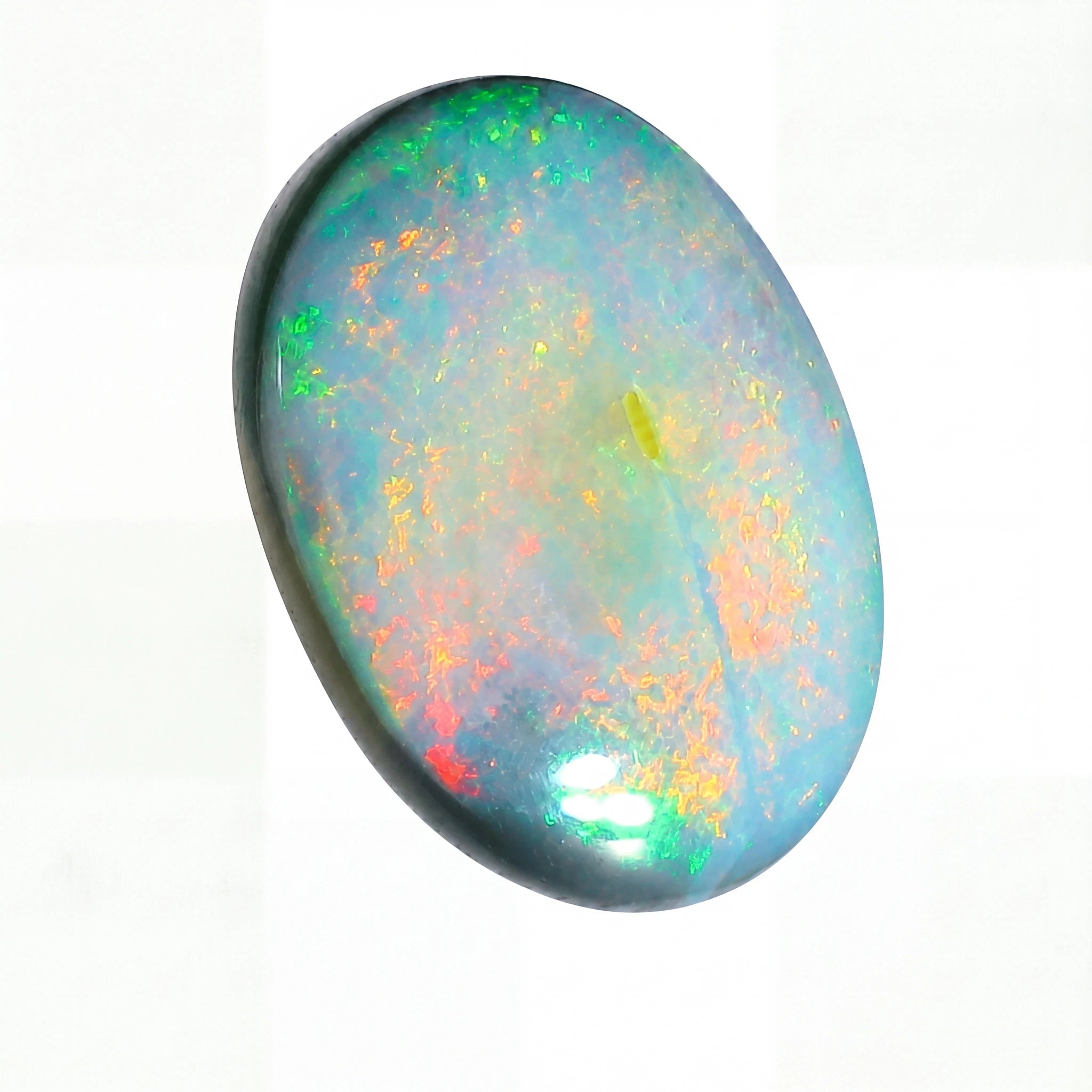 Multicoloured opal stone on a white background