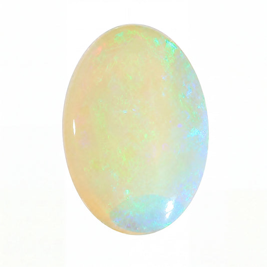 A polished oval cabochon opal gemstone displaying a soft pearlescent body with shifting iridescent flashes of blue, green, and yellow on a white background.