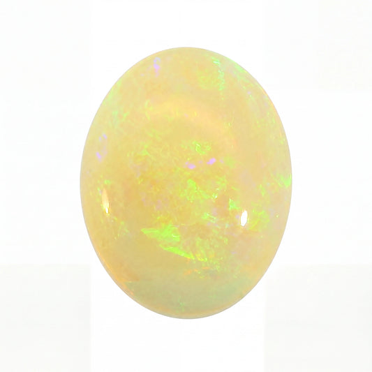 Opal stone with multicoloured play of light on a white background