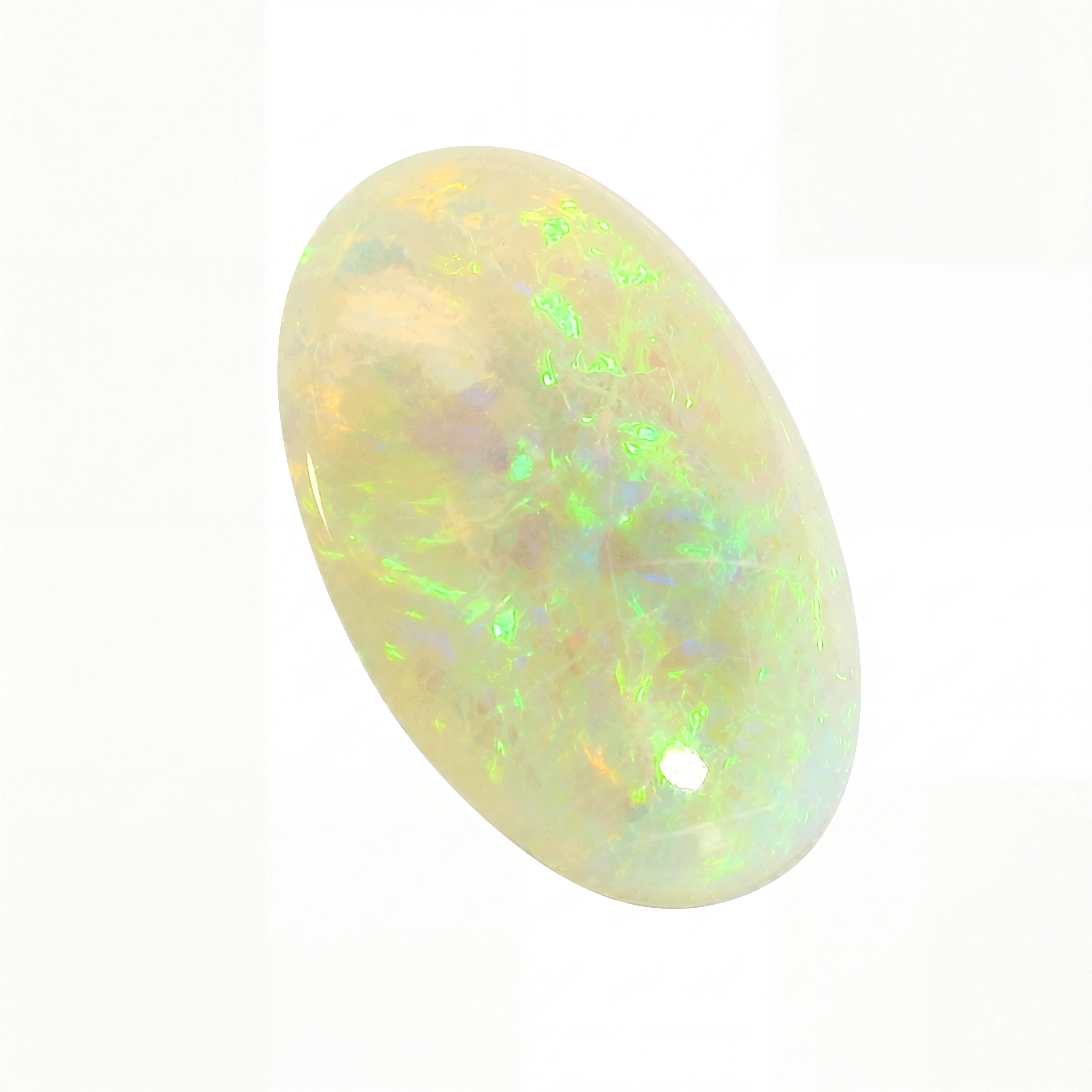 Opal stone with multicoloured play of colours on a white background