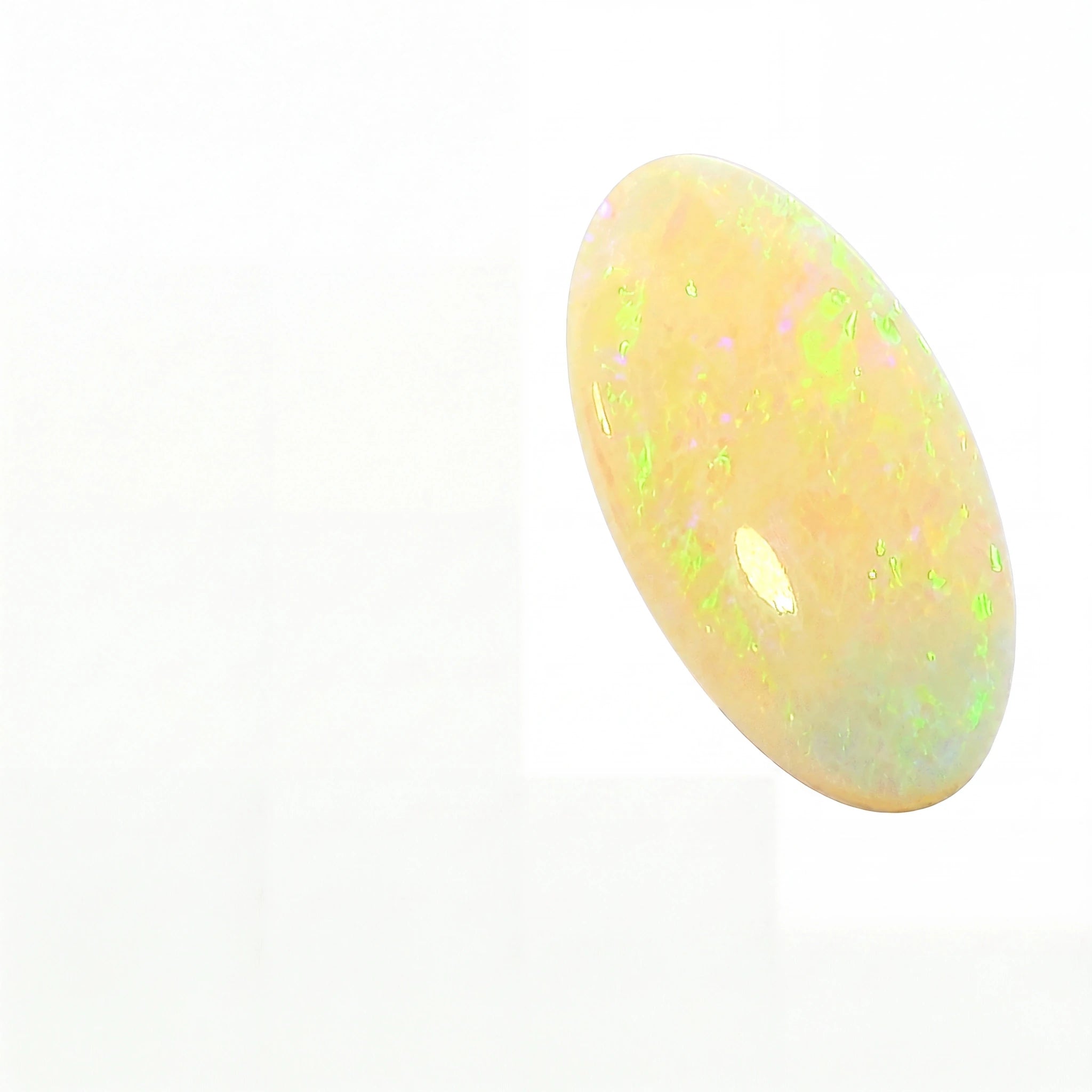 A polished oval cabochon opal gemstone with a creamy white base and vibrant iridescent flashes of green, yellow, and pink, shown on a plain white background.