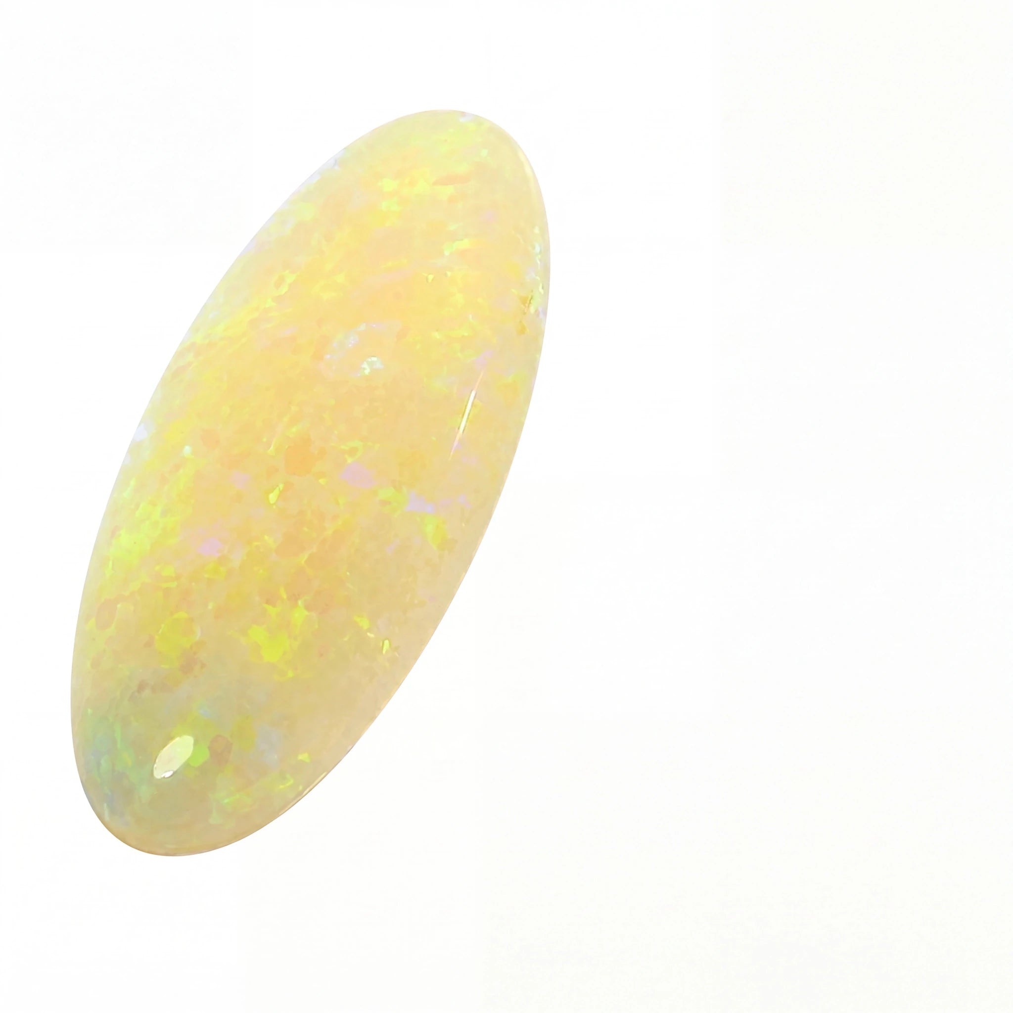Opal stone with a yellowish hue on a white background