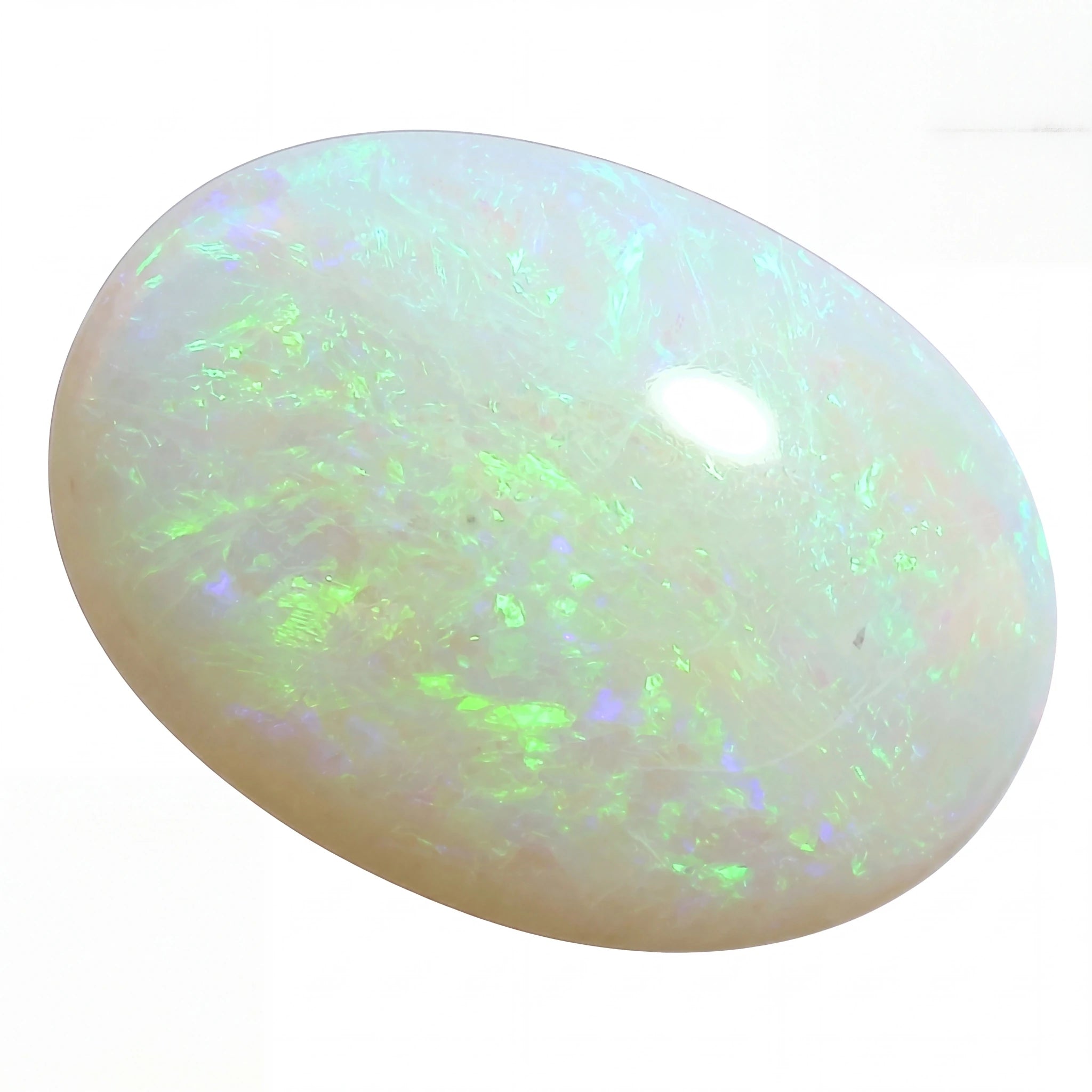 A polished oval cabochon opal gemstone displaying a play-of-colour with vibrant green, blue, and white iridescent flashes on a white background.