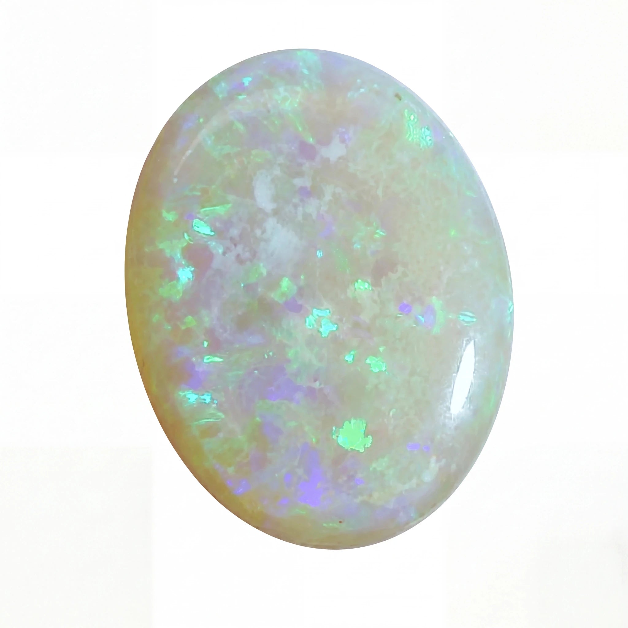 A polished oval cabochon opal gemstone displaying a play-of-colour with iridescent flashes of green, blue, purple, and white over a warm cream and peach base, set against a plain white background.
