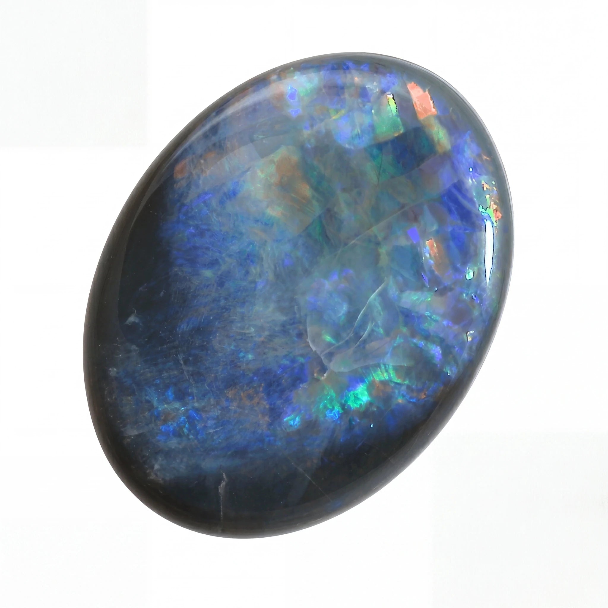 Multicoloured opal stone on a white background