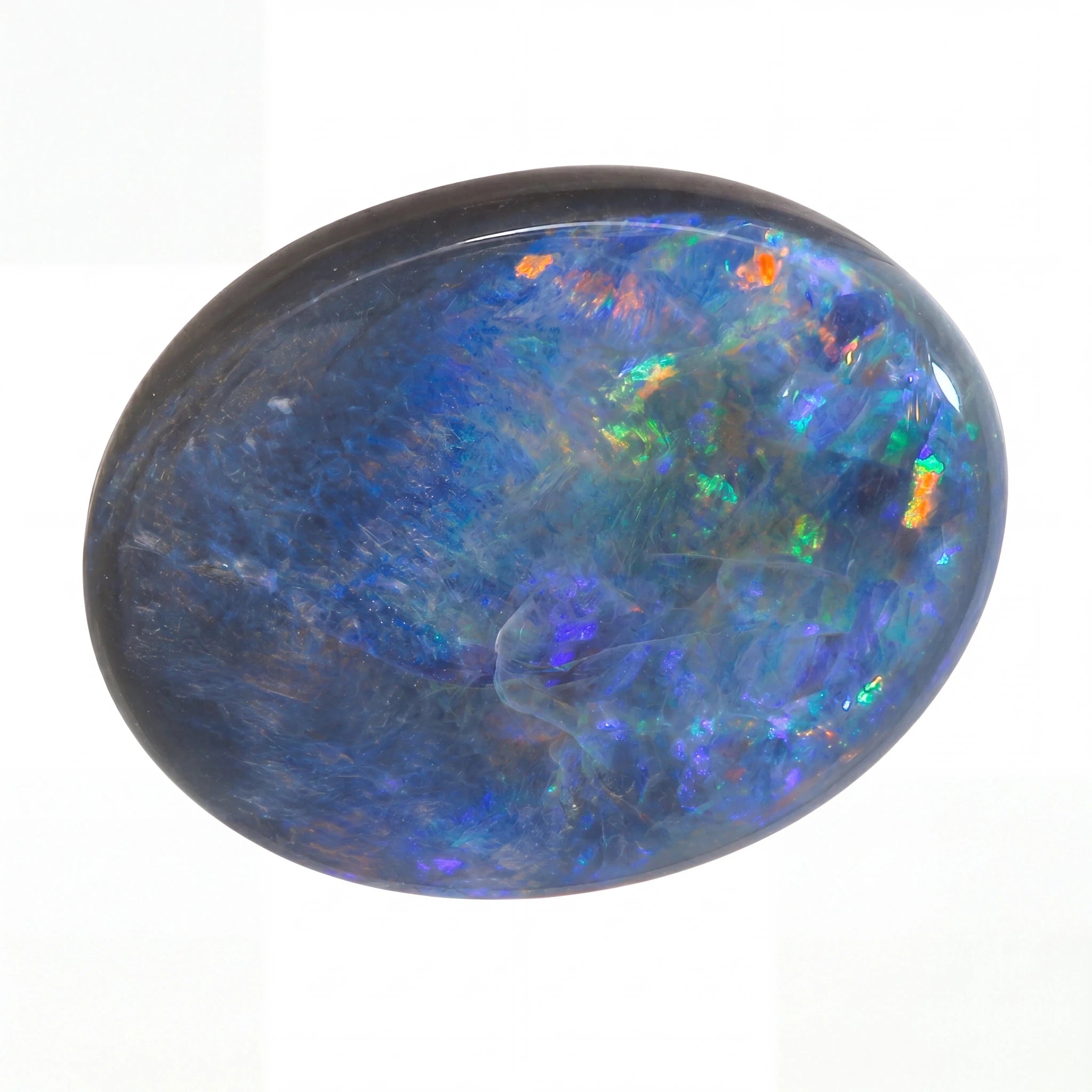 Multicoloured opal stone on a white background