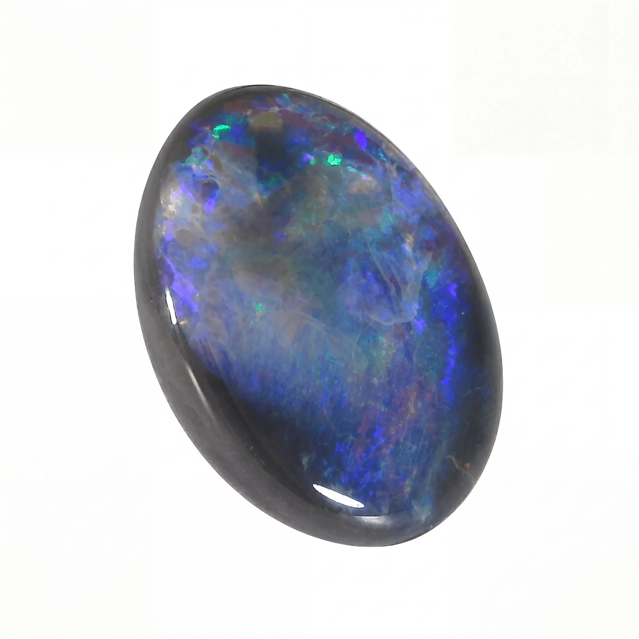 Oval-shaped opal stone with multicoloured play of light on a white background
