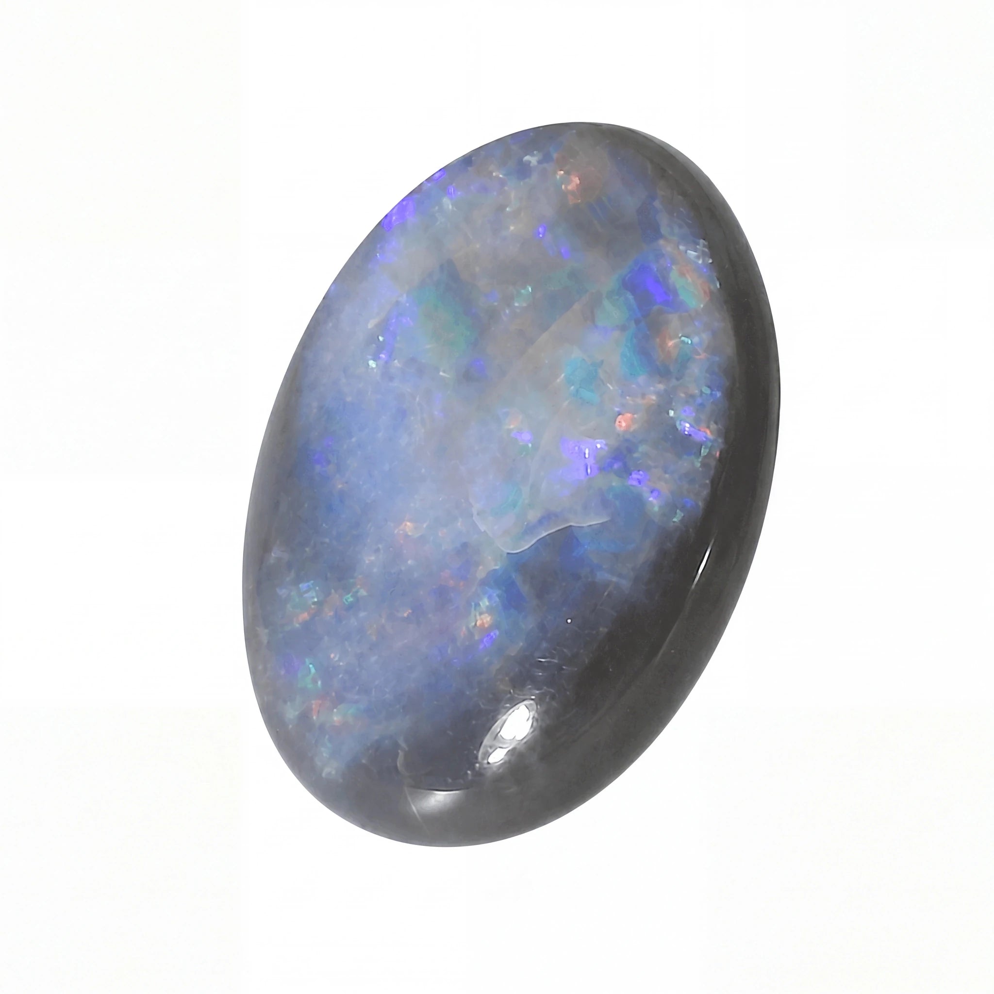 Opal stone with multicoloured play of colours on a white background