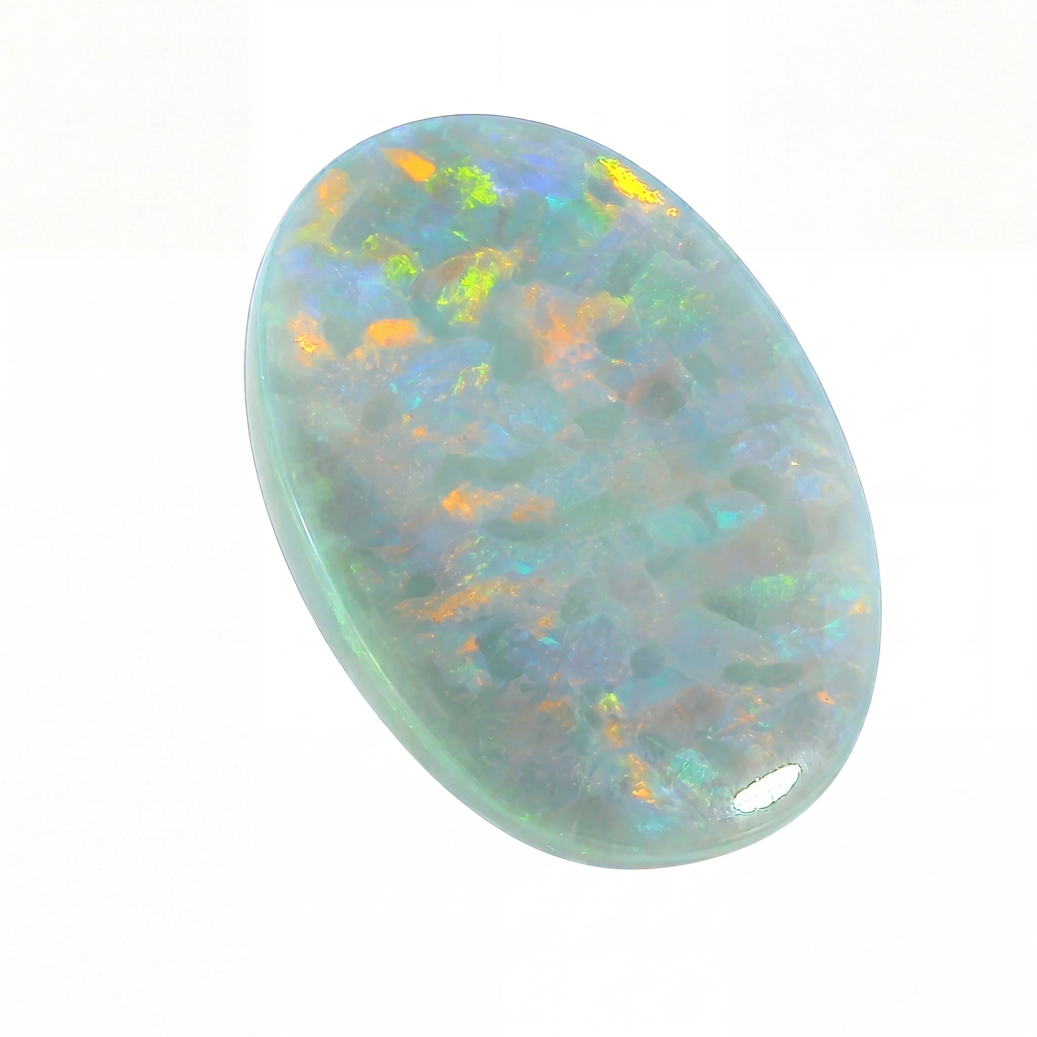 Oval-shaped opal stone with multicoloured play of light on a white background