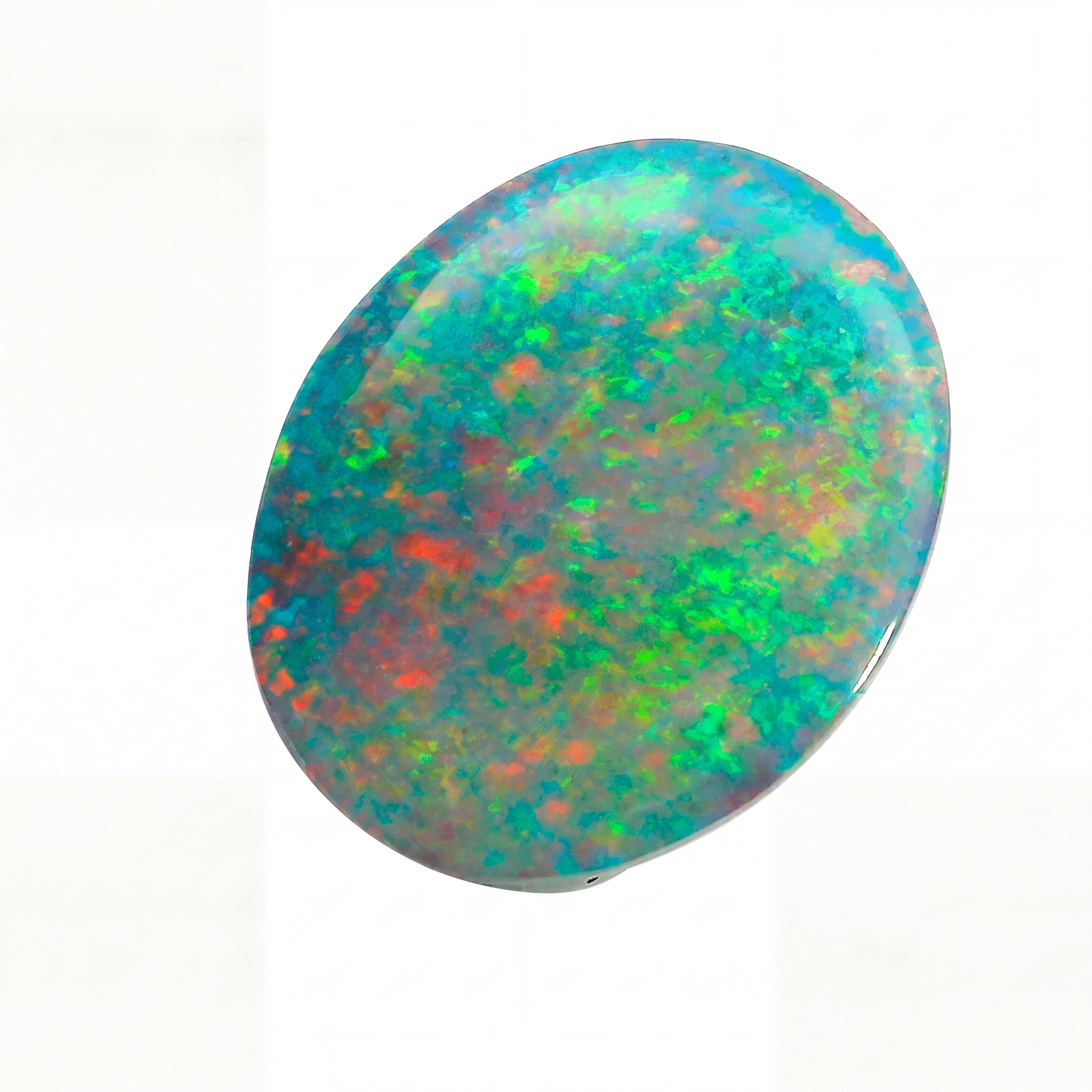 Multicoloured opal stone on a white background