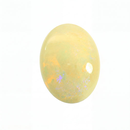 Yellow opal stone with speckled patterns on a white background