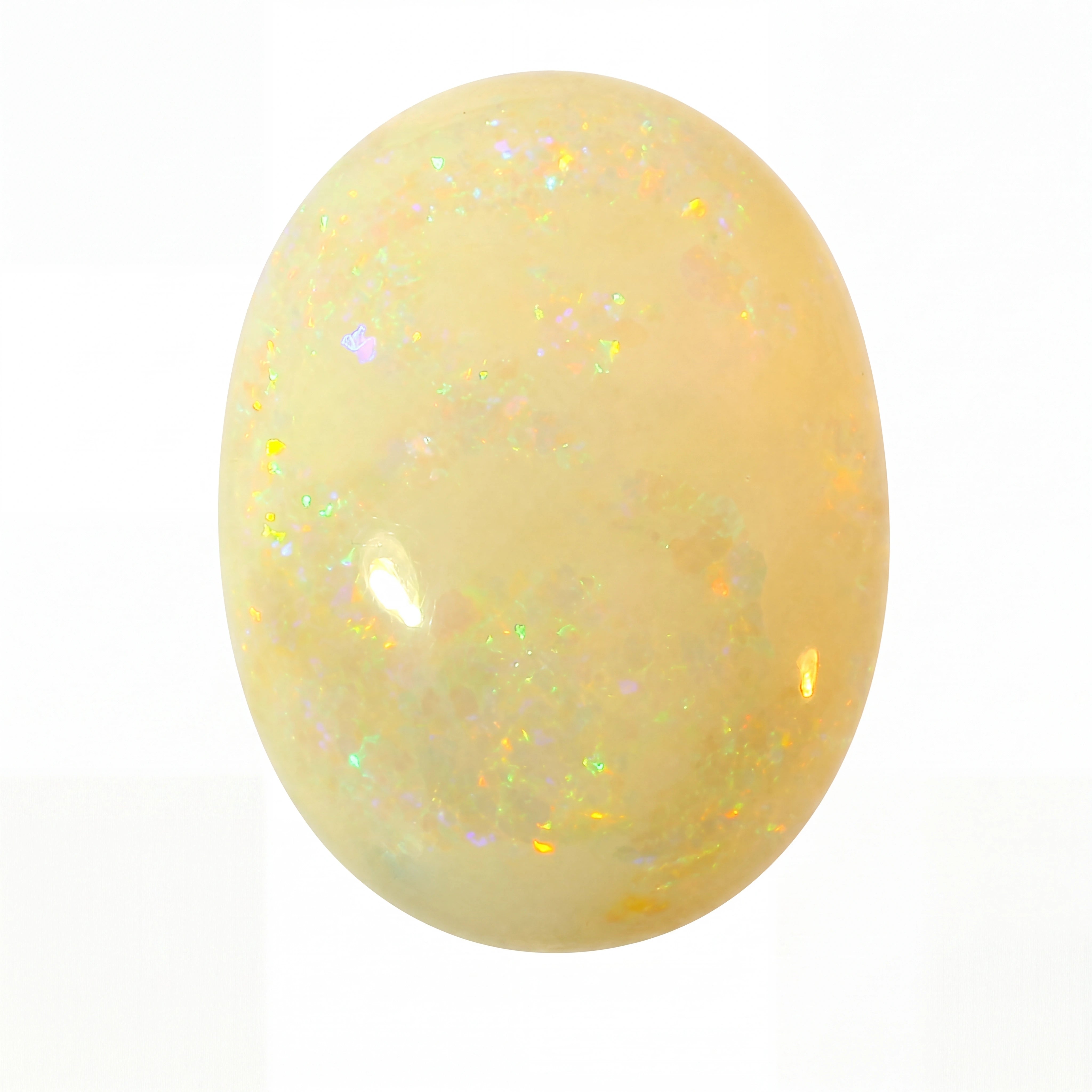 Yellow opal stone with a sparkly surface on a white background