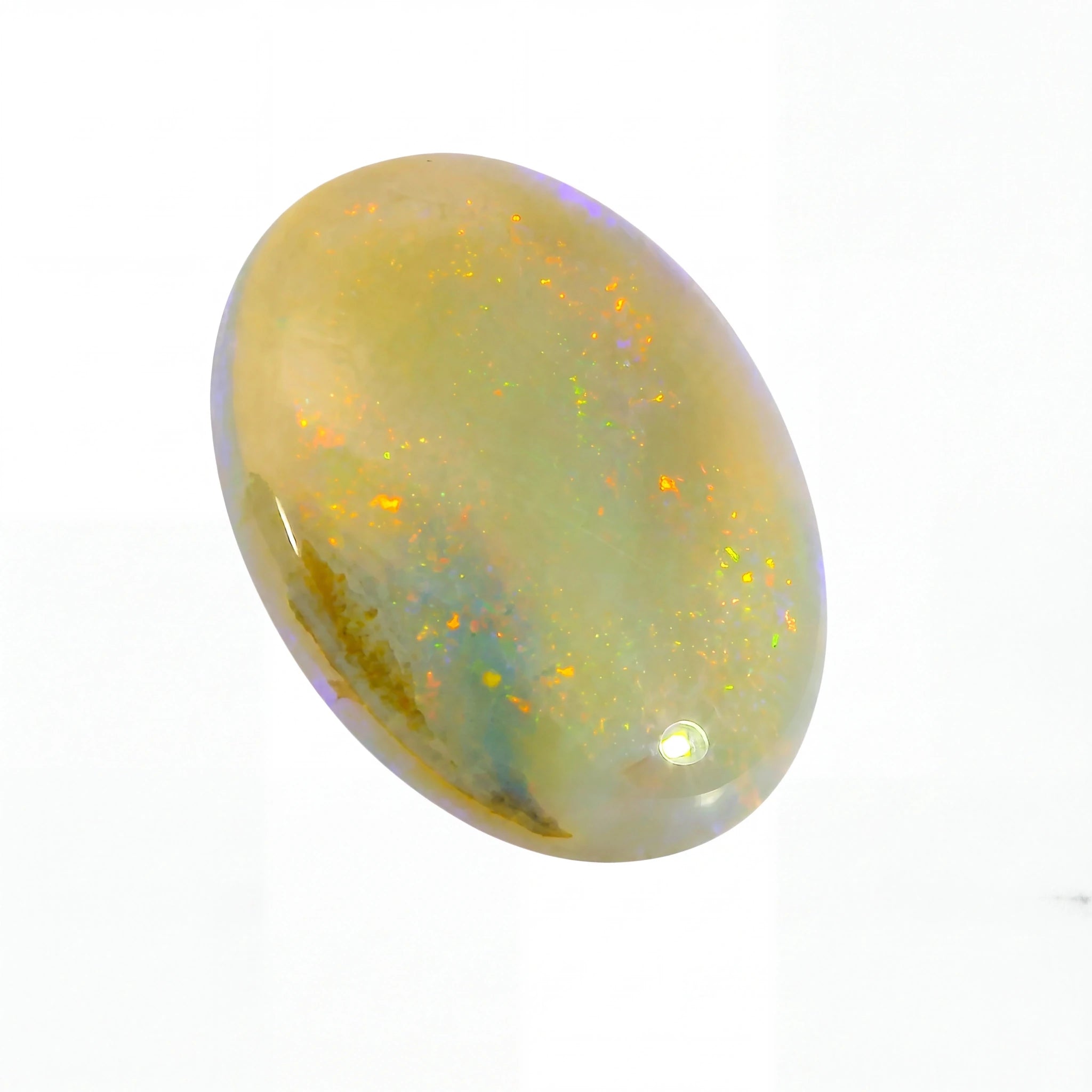 Opal stone with a play of colours on a white background