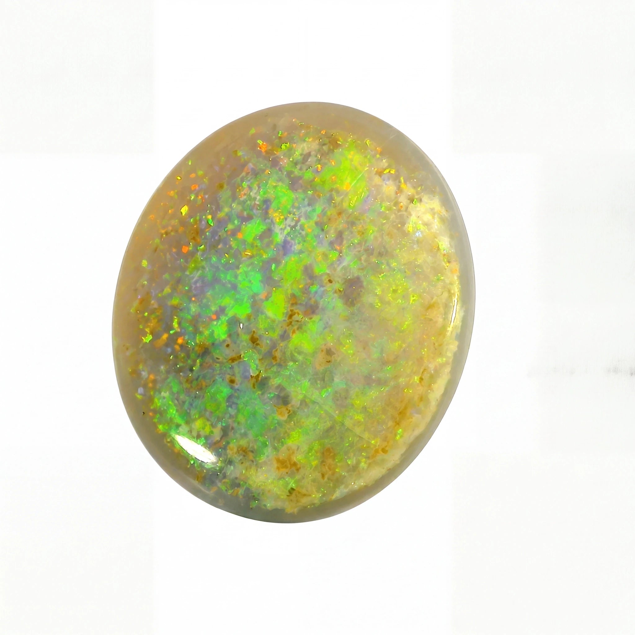 A polished oval cabochon opal gemstone displaying vibrant flashes of green, yellow, orange, and blue iridescence over a warm beige-brown base, set against a plain white background.