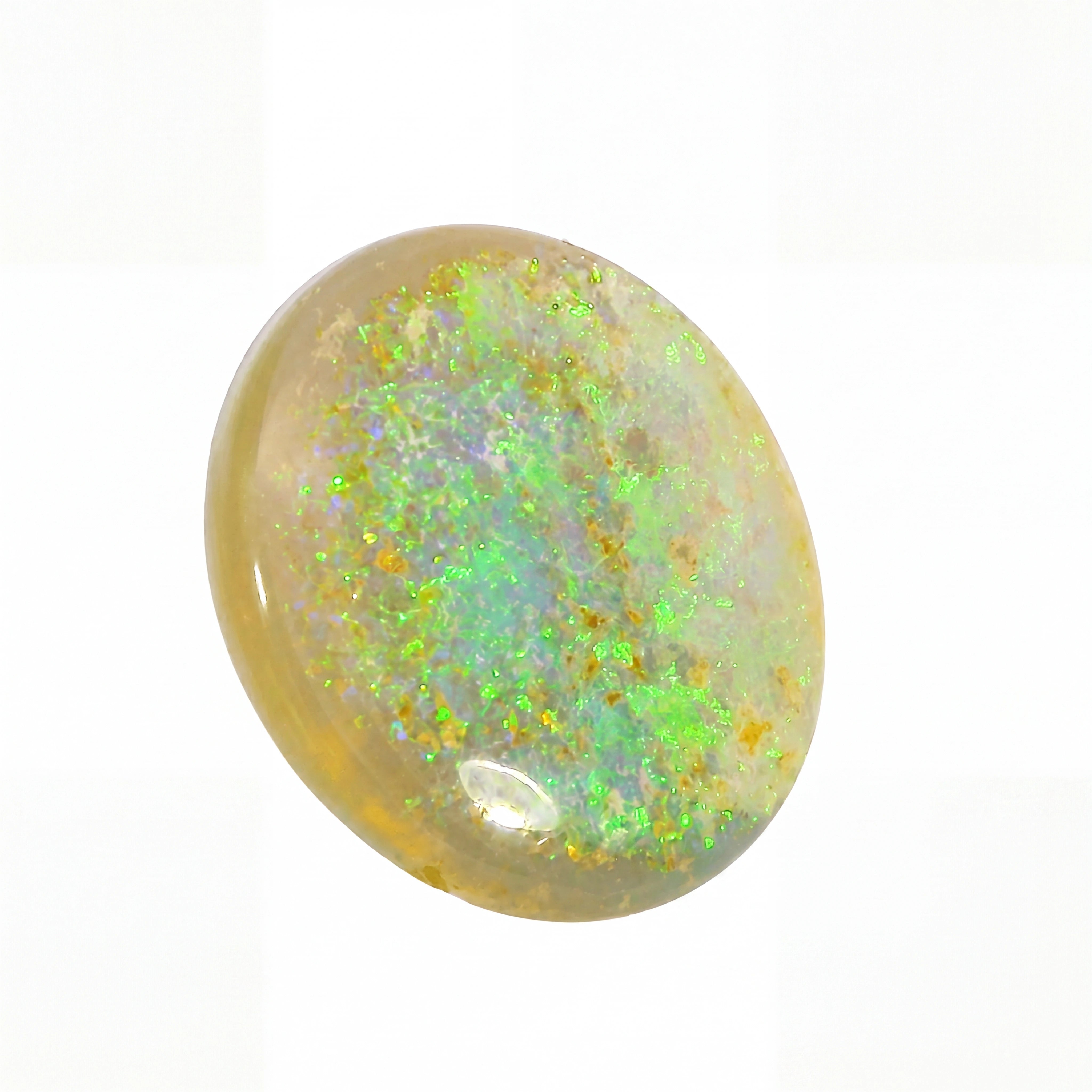 Opal stone with green and yellow fluorescence on a white background