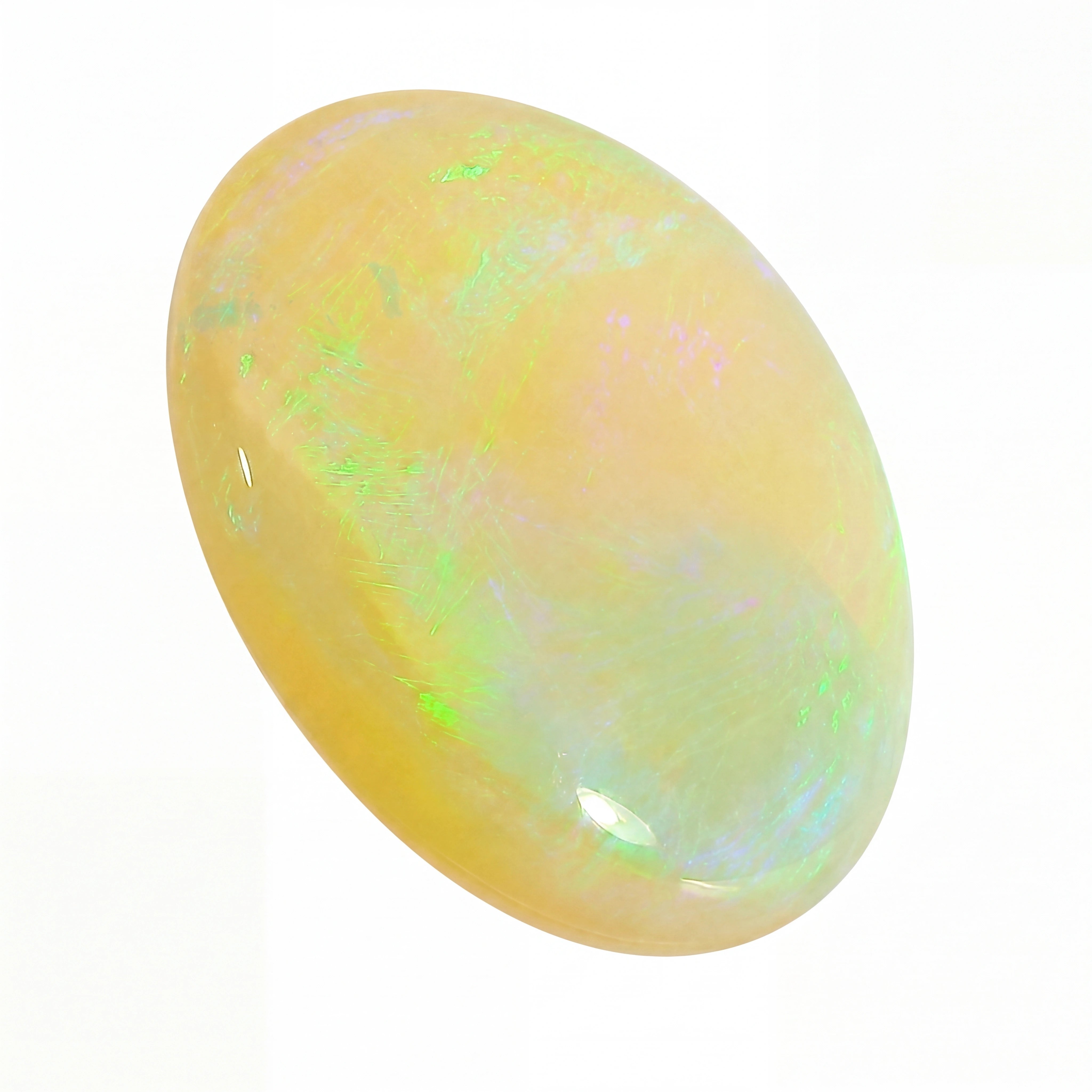 Opal stone with multicolour play of light on a white background