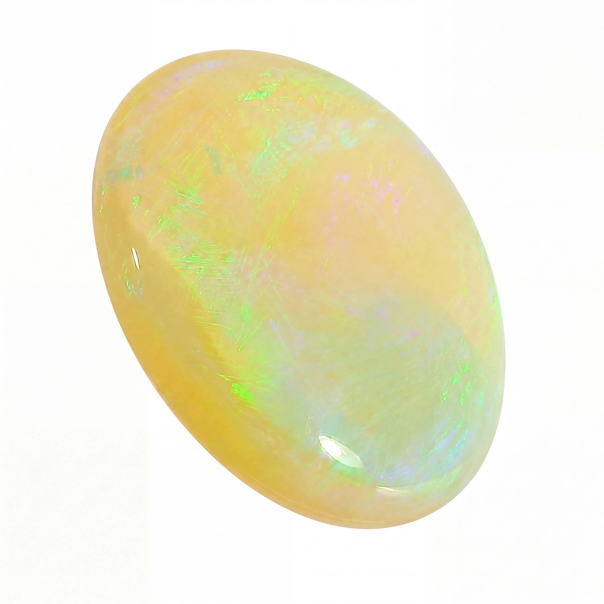 Opal stone with multicolour play of light on a white background