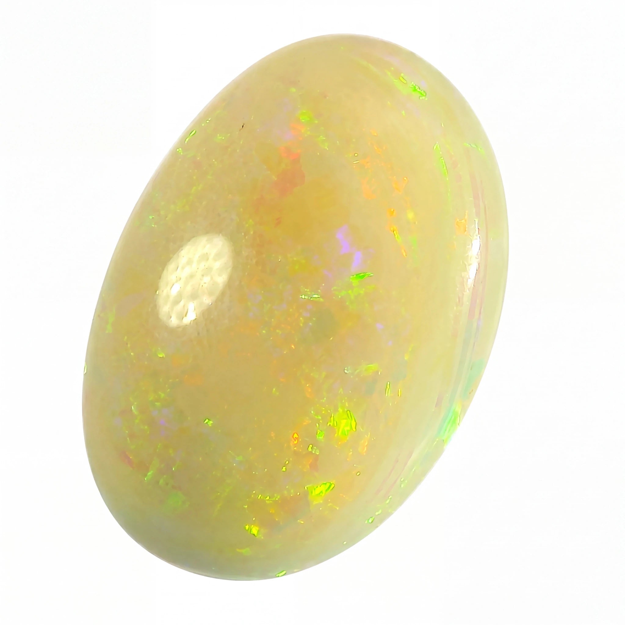 Opal stone with multicoloured fluorescence on a white background