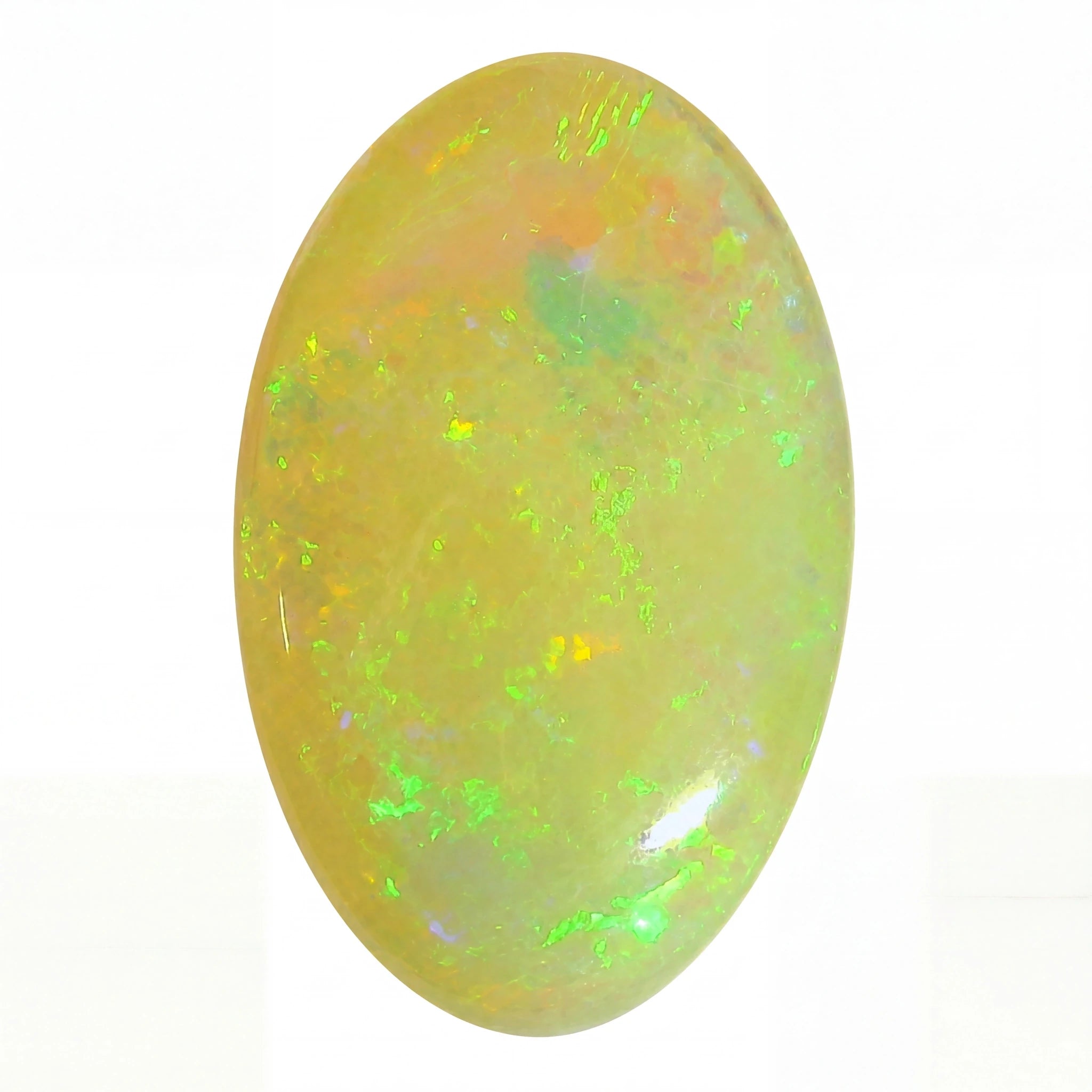 A polished oval cabochon opal gemstone displaying a mix of yellow, orange, and vibrant green flashes on a plain white background.