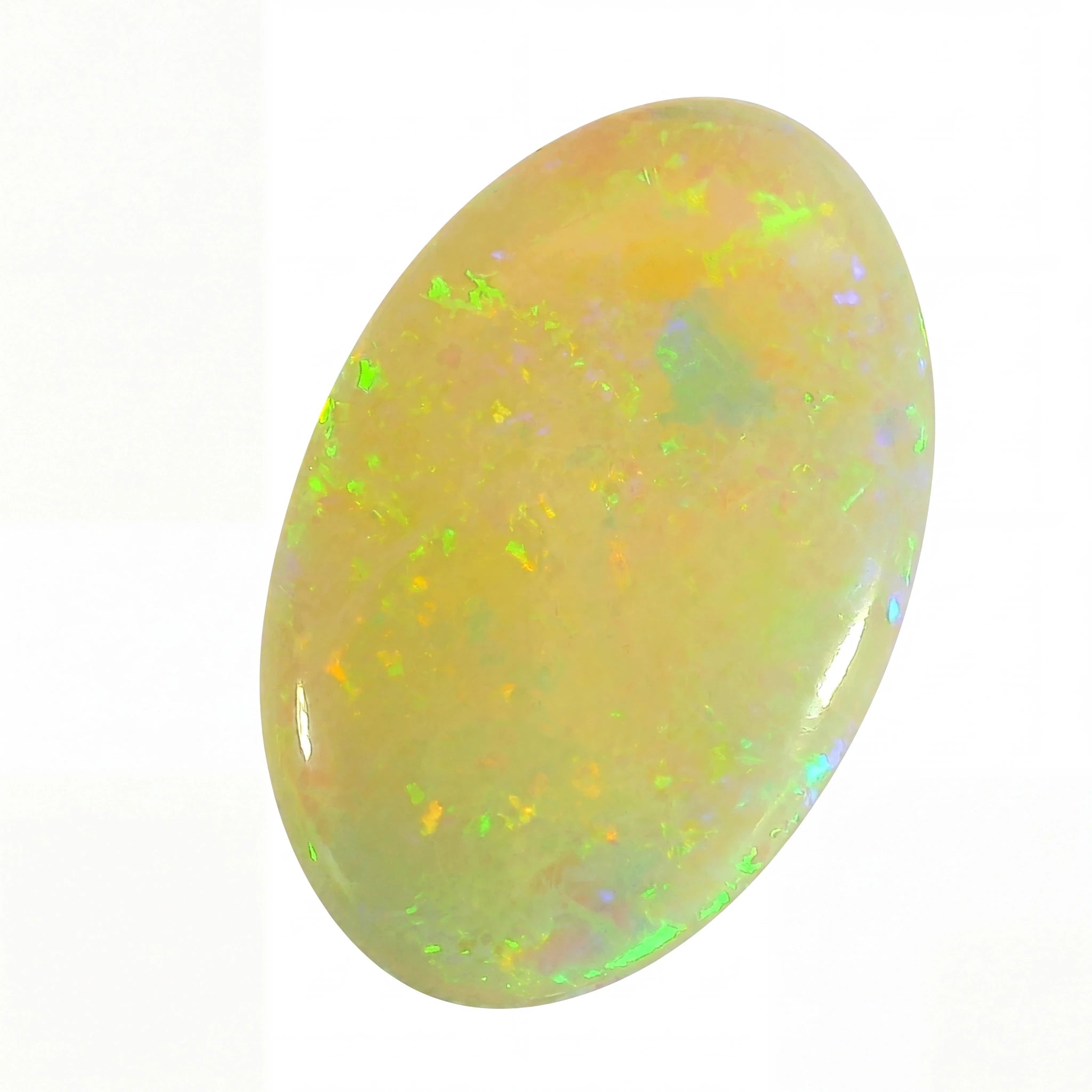 Opal stone with green and yellow fluorescence on a white background