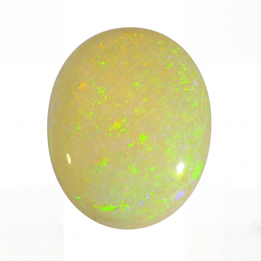 A polished oval cabochon opal gemstone displaying a creamy beige base with vibrant, shifting flashes of neon green, yellow, and hints of blue on a white background.