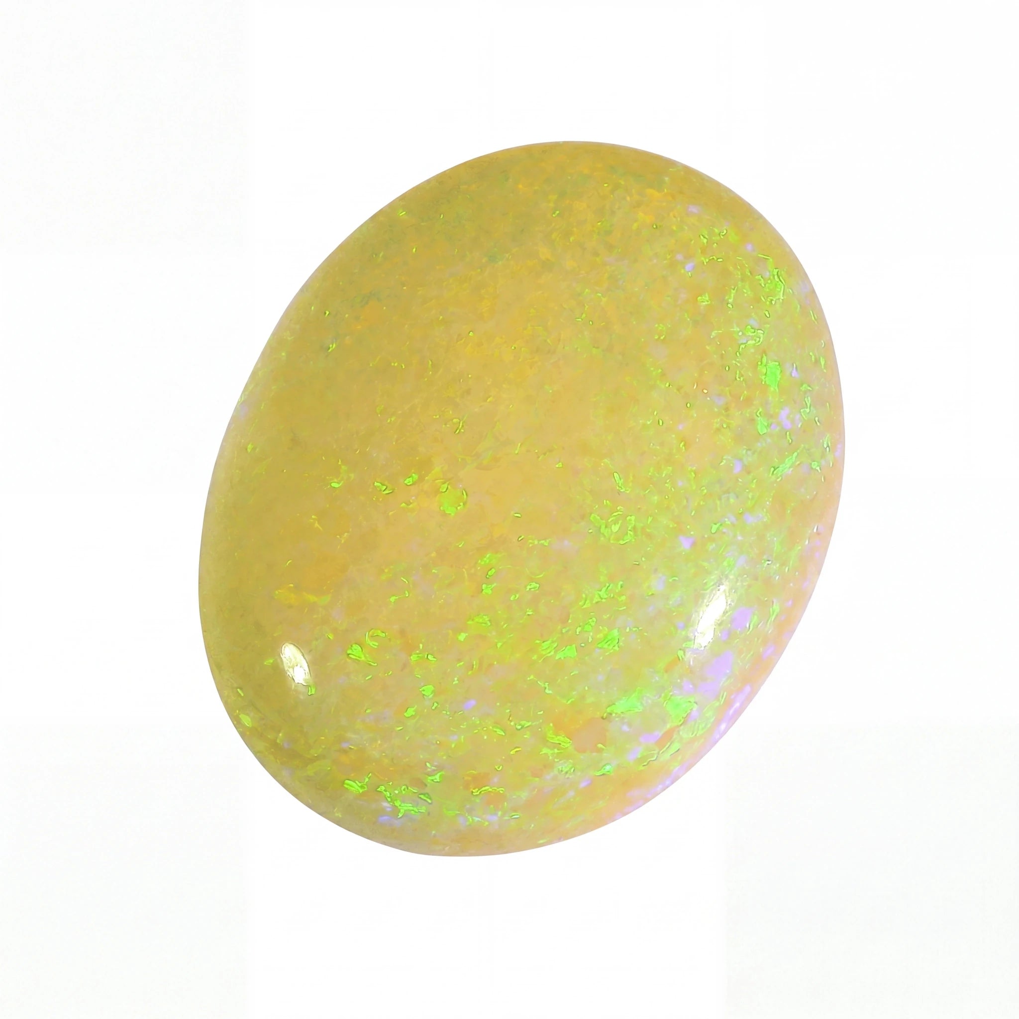 Yellow stone with green specks on a white background