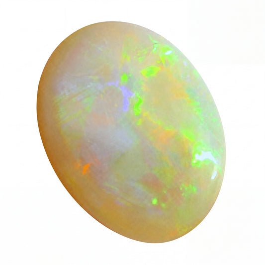 Opal gemstone with multicoloured play of light on a white background