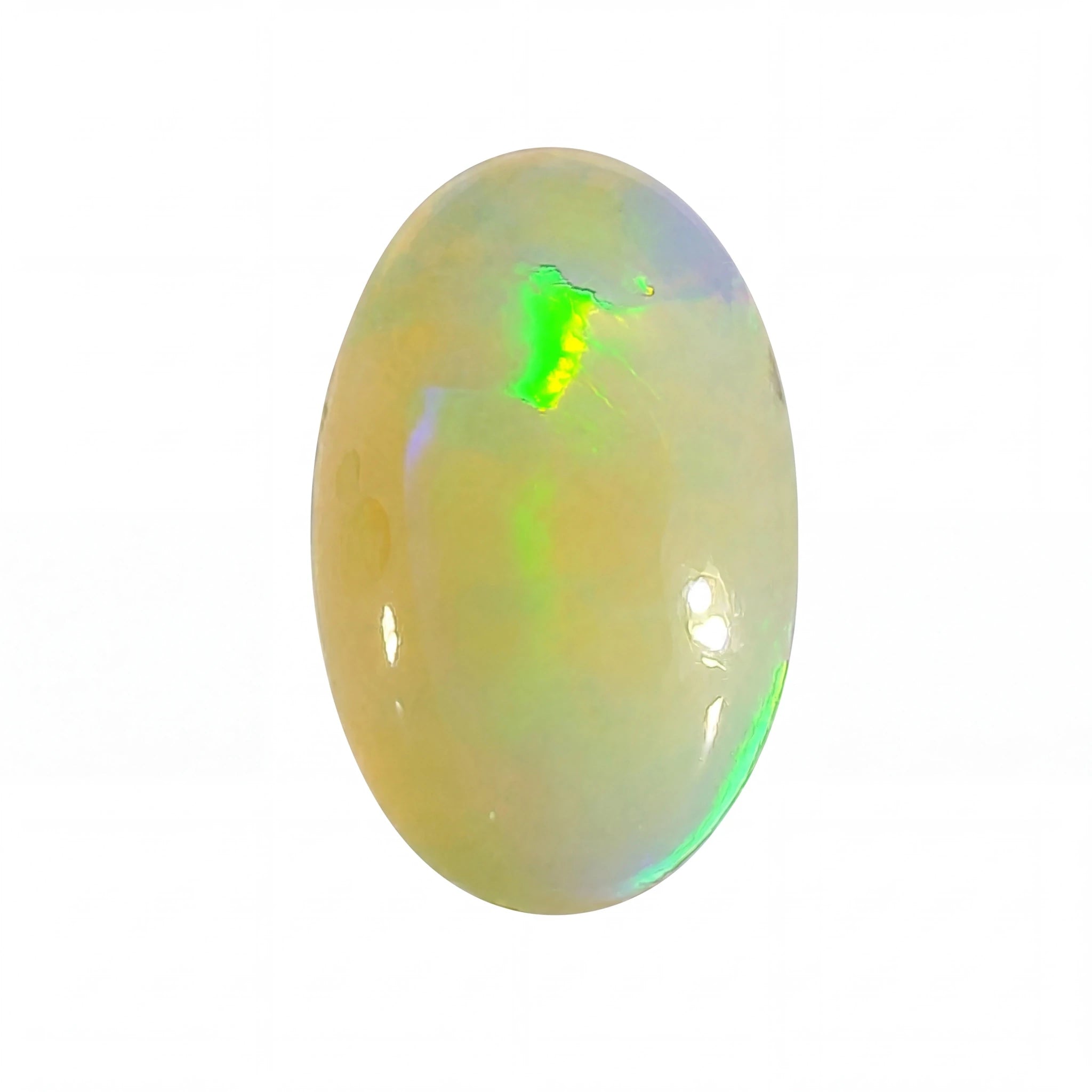 A polished oval cabochon opal gemstone displaying a creamy off-white body with vibrant iridescent flashes of green and blue, set against a plain white background.