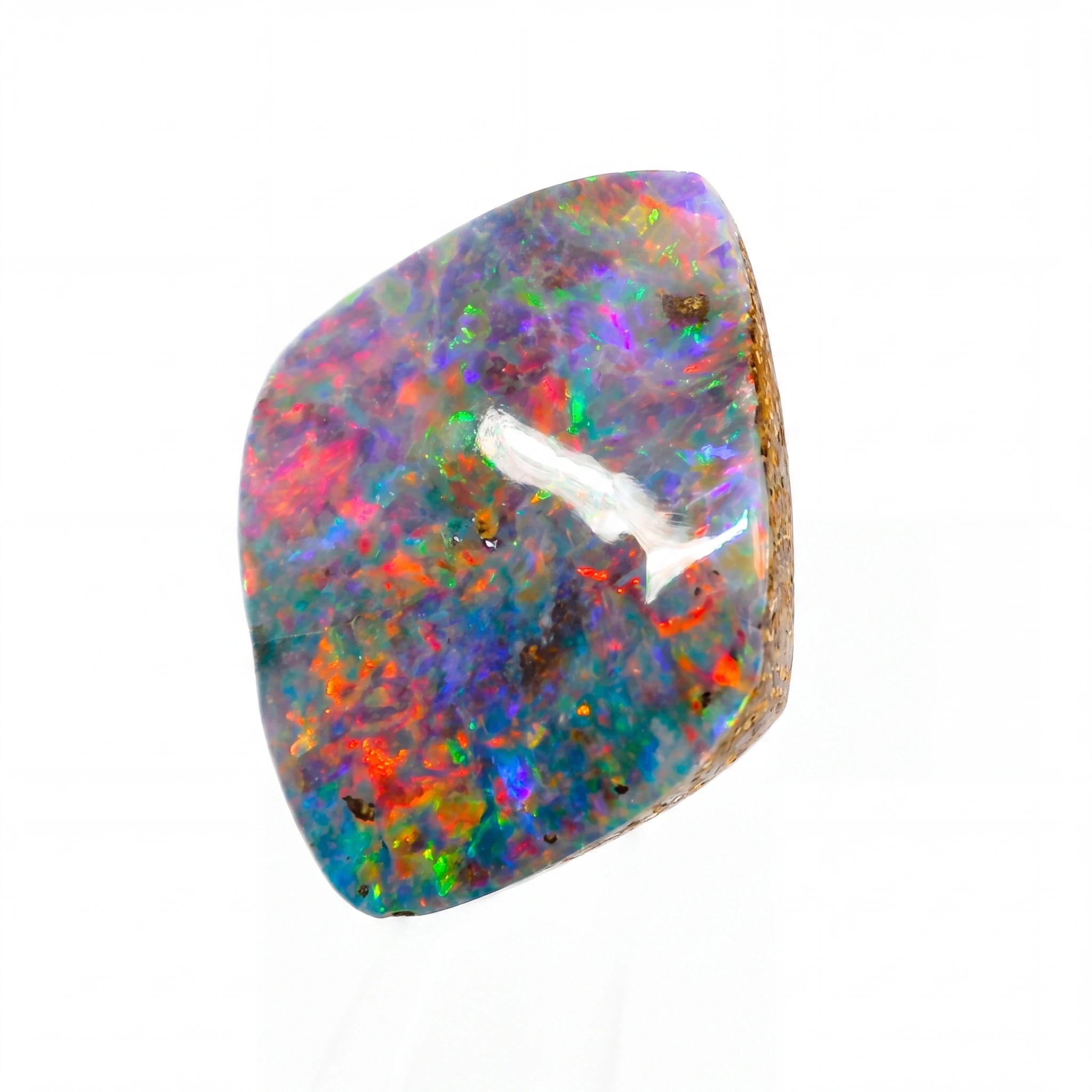 Multicoloured opal stone on a white background