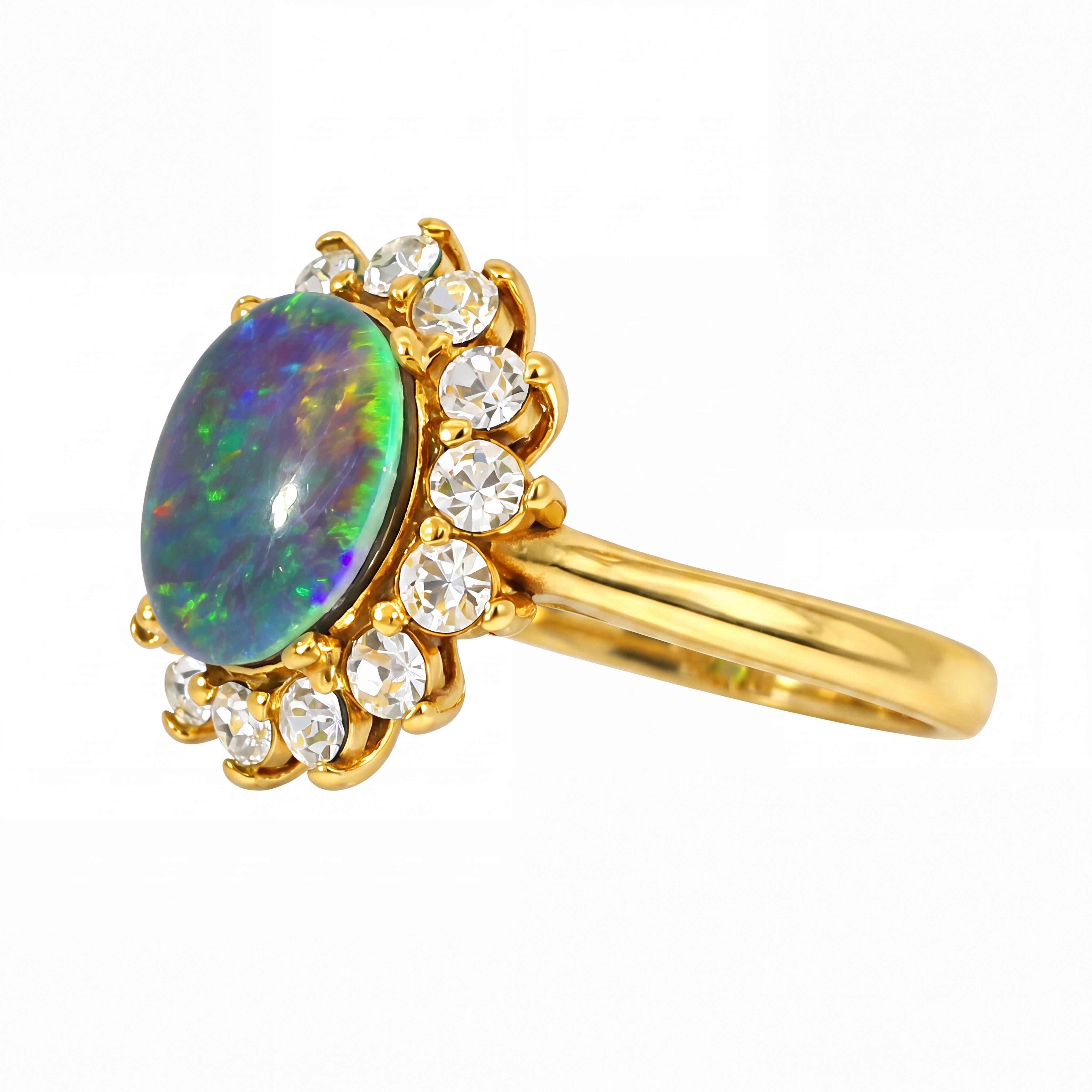Gold pendant with an opal stone and clear gemstones on a white background